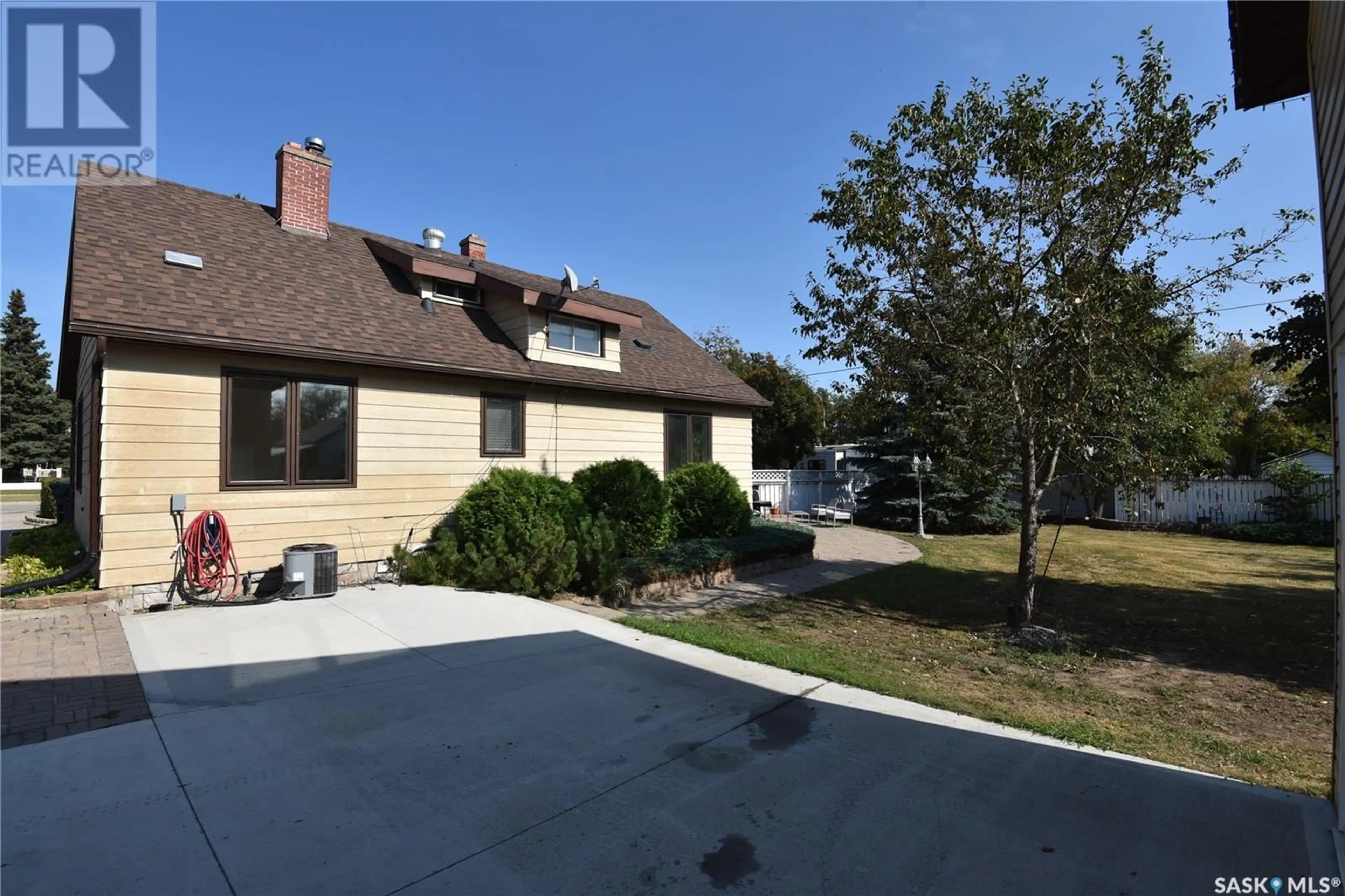 Frontside or backside of a home, the fenced backyard for 412 Centre STREET, Nipawin Saskatchewan S0E1E0