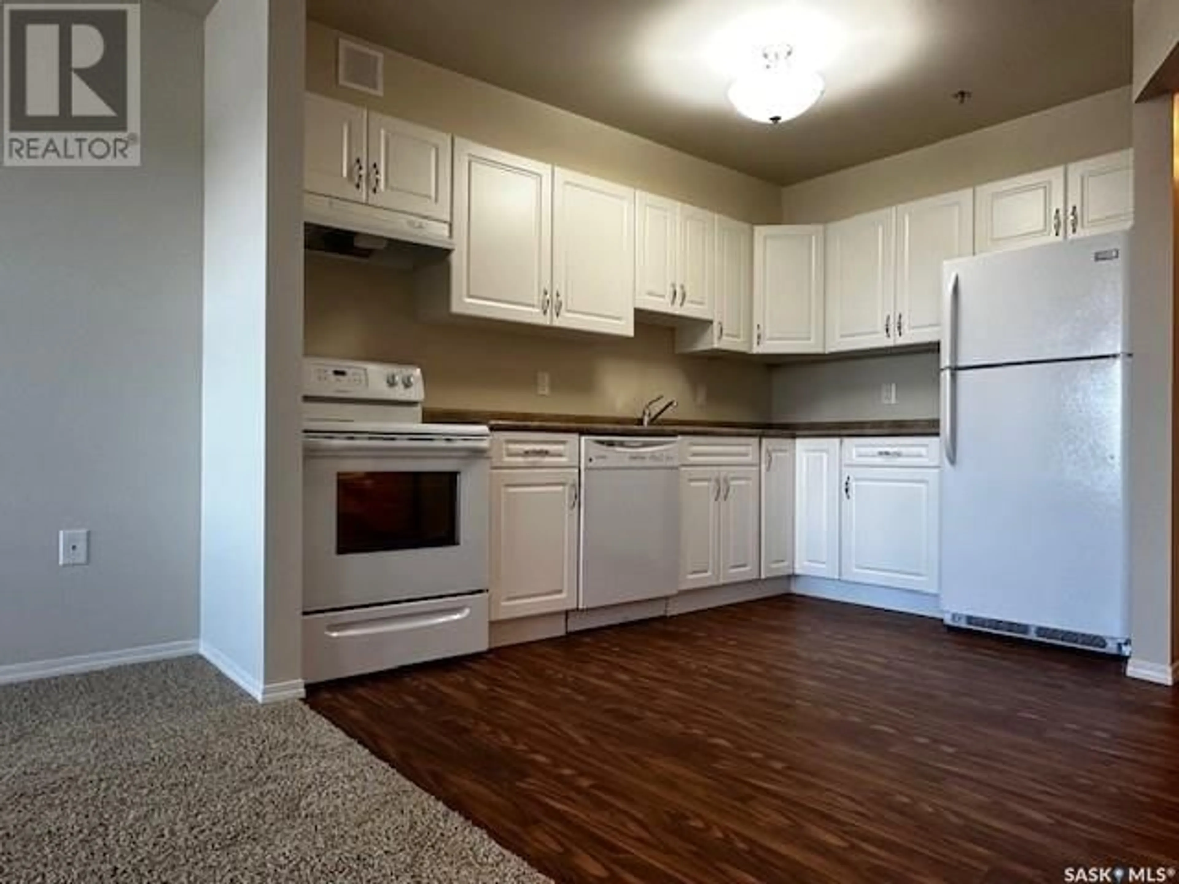 Standard kitchen, wood floors for 303 680 7th AVENUE E, Melville Saskatchewan S0A2P1