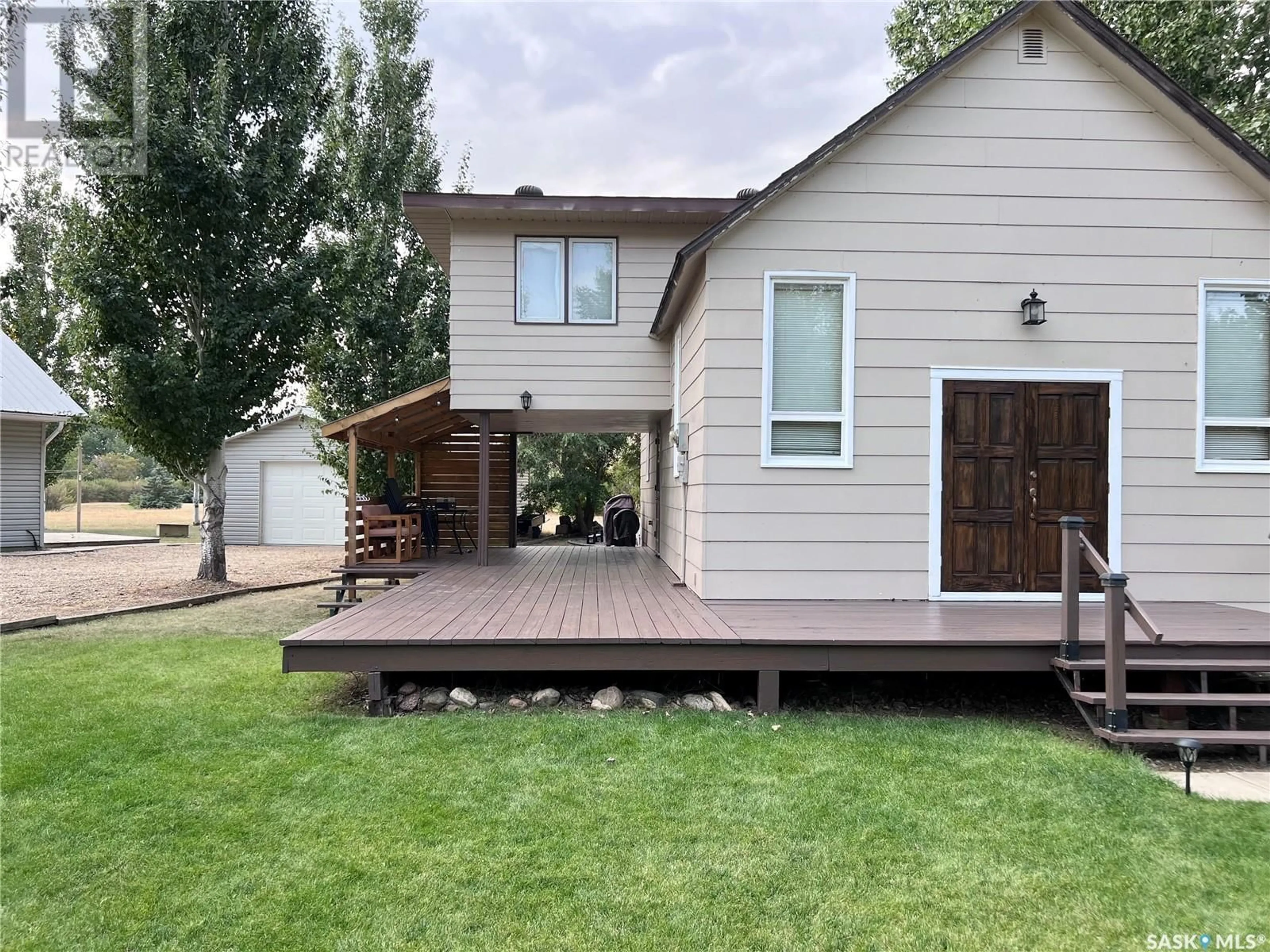 Frontside or backside of a home, the fenced backyard for 307 Ruby DRIVE, Hitchcock Bay Saskatchewan S0L0G0