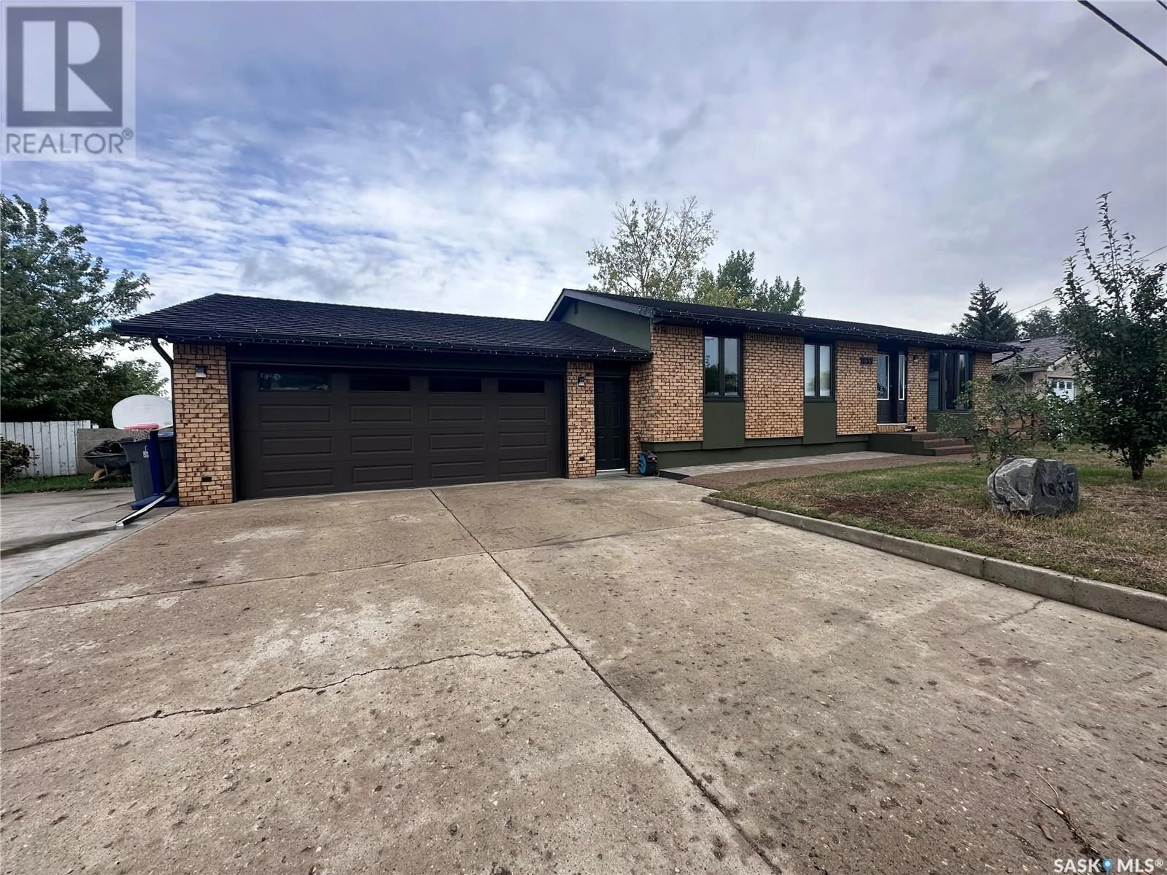 Home with brick exterior material for 1833 Alice ROAD, Estevan Saskatchewan S4A1G7