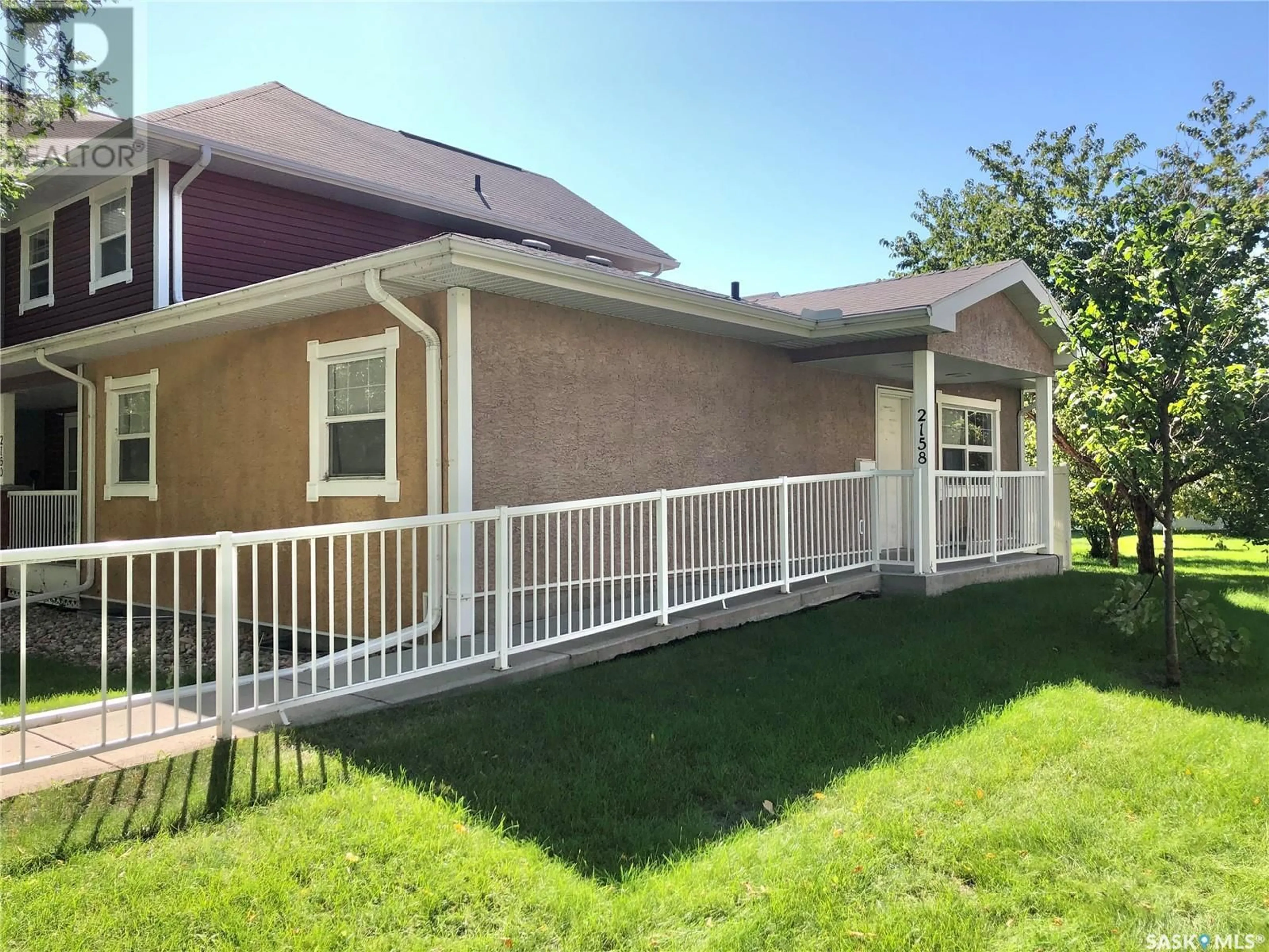 Frontside or backside of a home, the fenced backyard for 14 2158 Montreal STREET, Regina Saskatchewan S4P0C6