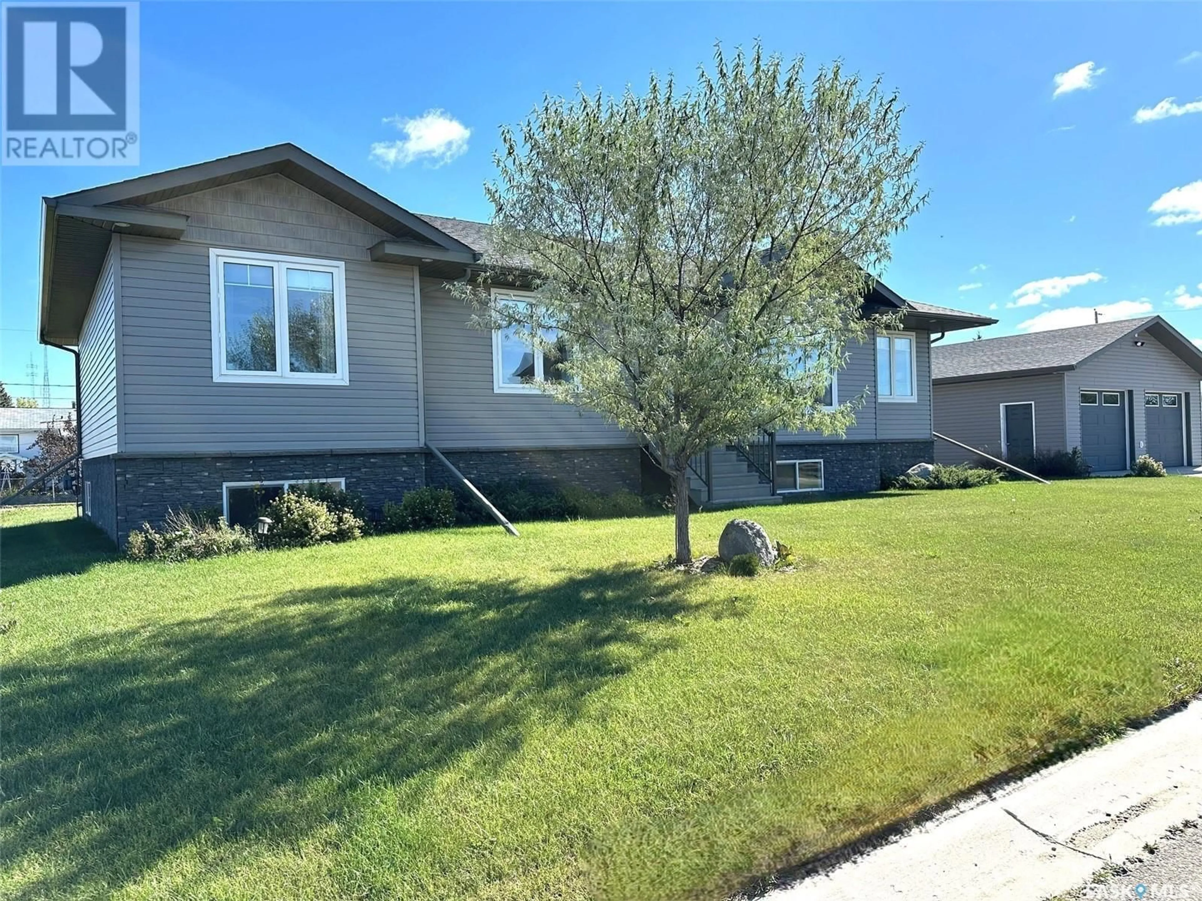 Home with vinyl exterior material, street for 507 ANDERSON DRIVE, Hudson Bay Saskatchewan S0E0Y0