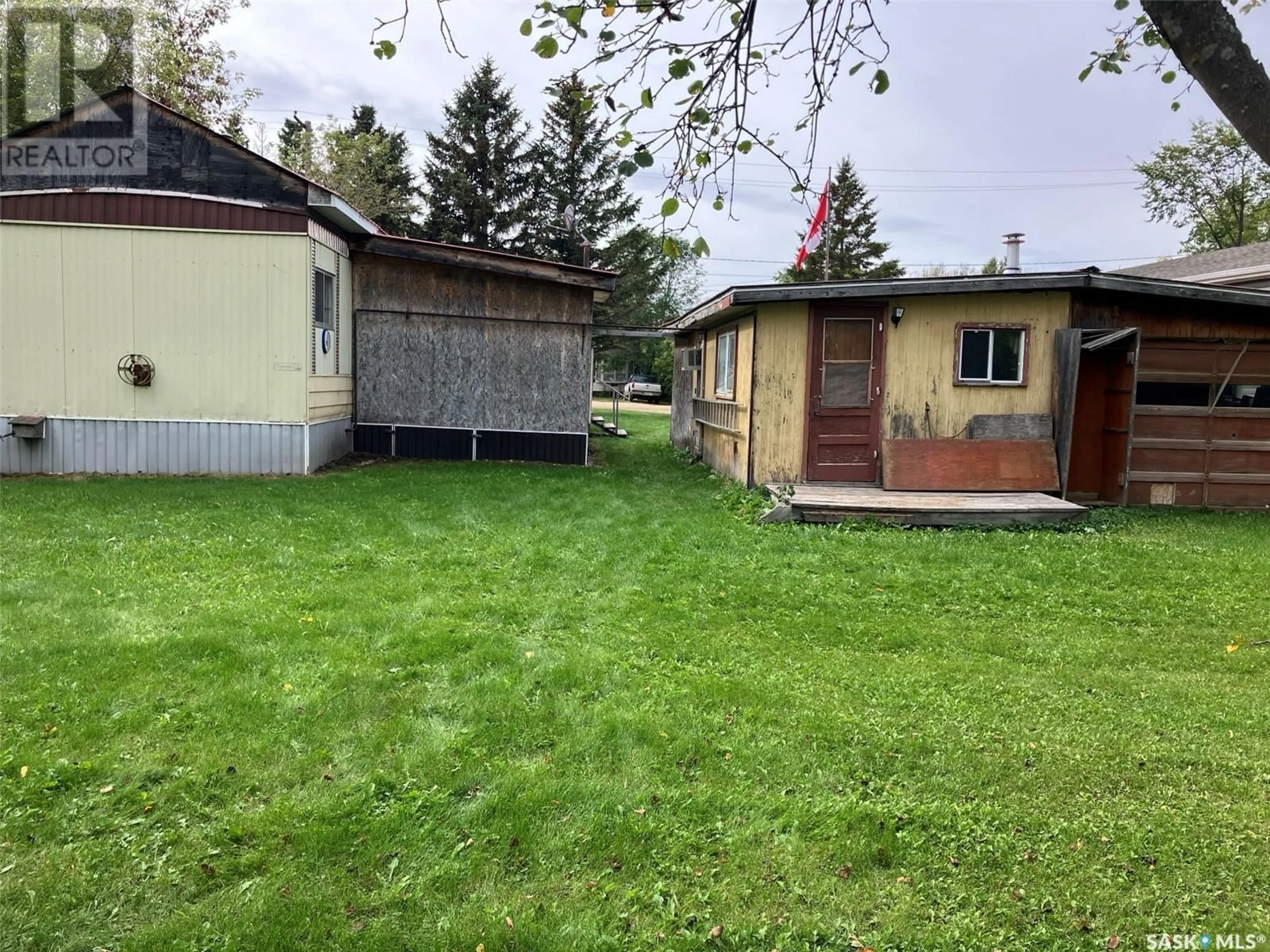 Frontside or backside of a home, the fenced backyard for 520 Parkdale STREET, Carrot River Saskatchewan S0E0L0