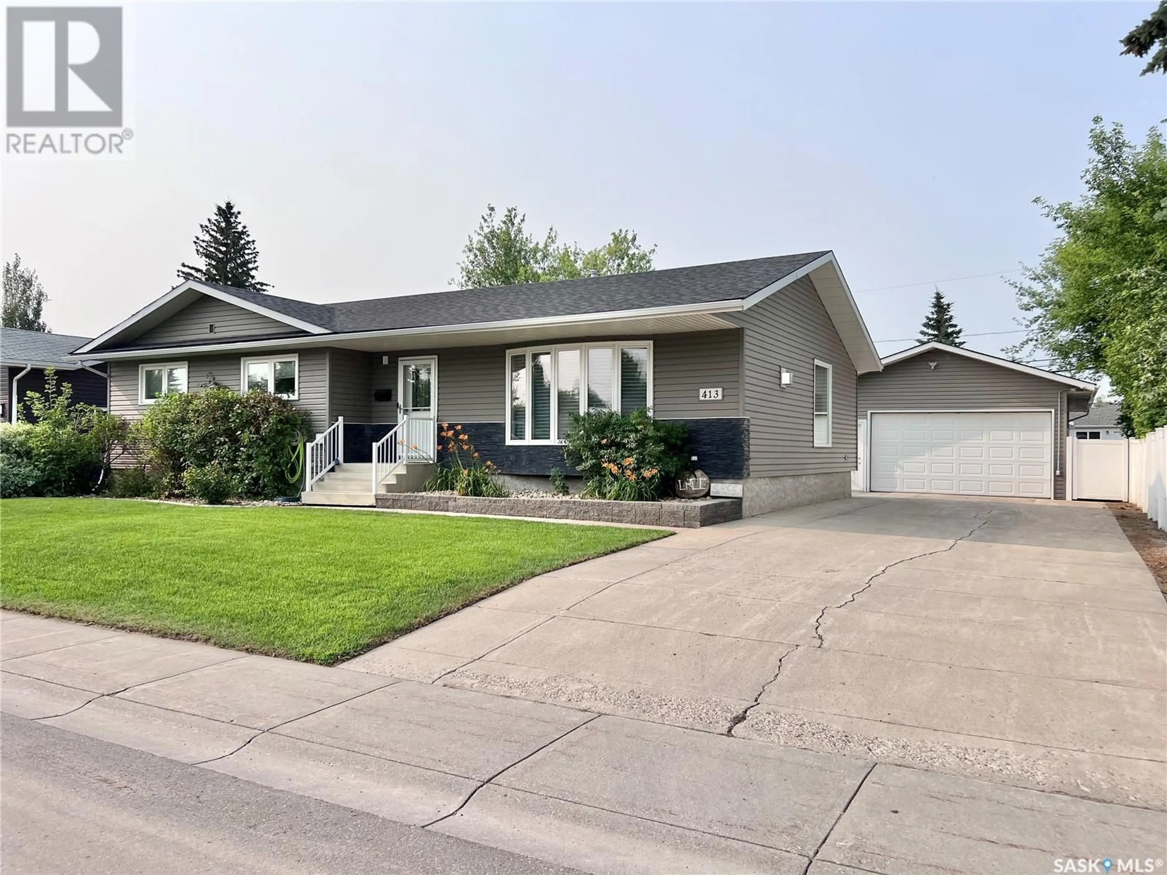 Frontside or backside of a home for 413 3rd STREET N, Martensville Saskatchewan S0K2T2