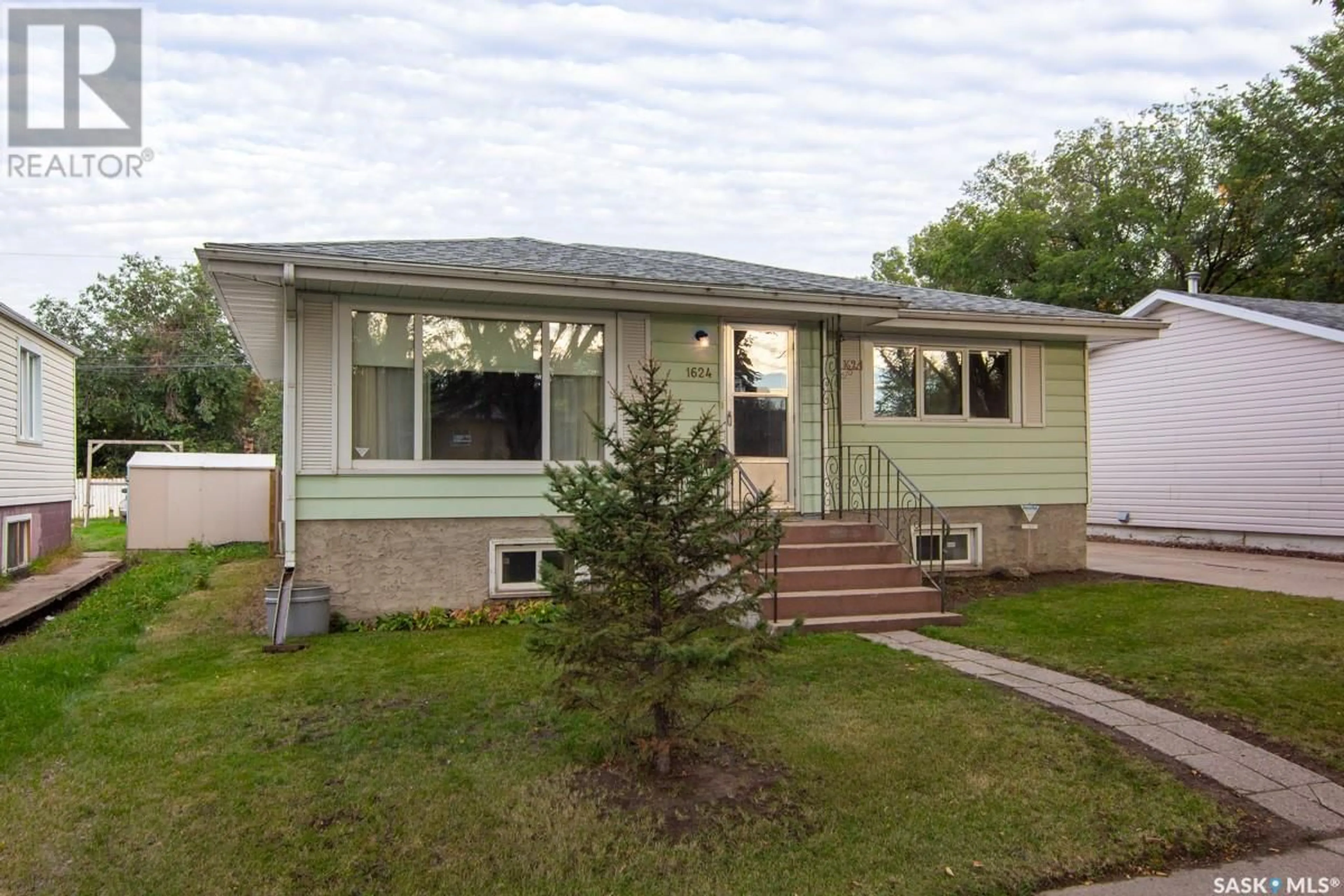 Home with vinyl exterior material for 1624 C AVENUE N, Saskatoon Saskatchewan S7L1L5