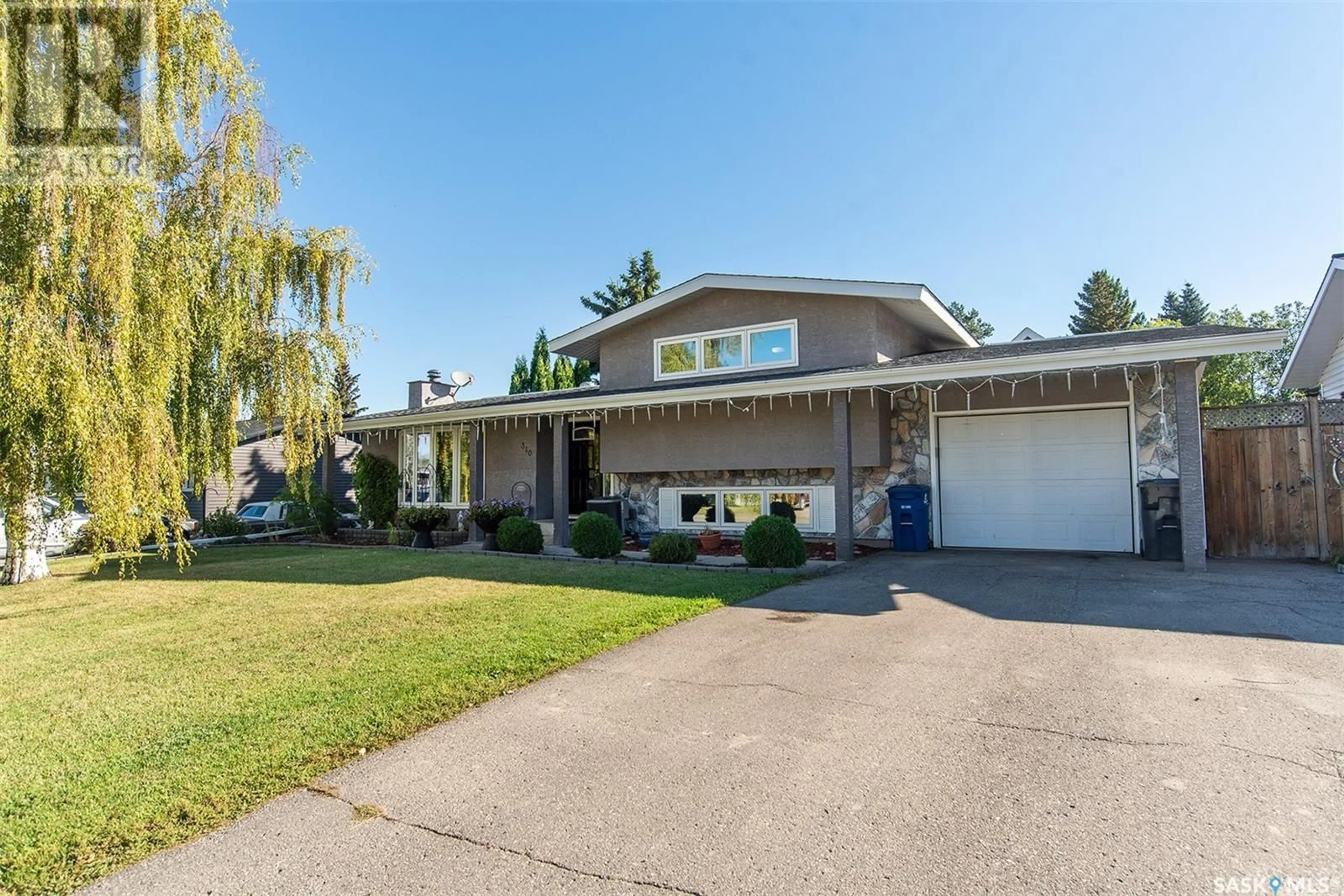 Frontside or backside of a home for 310 8th STREET E, Wynyard Saskatchewan S0A4T0