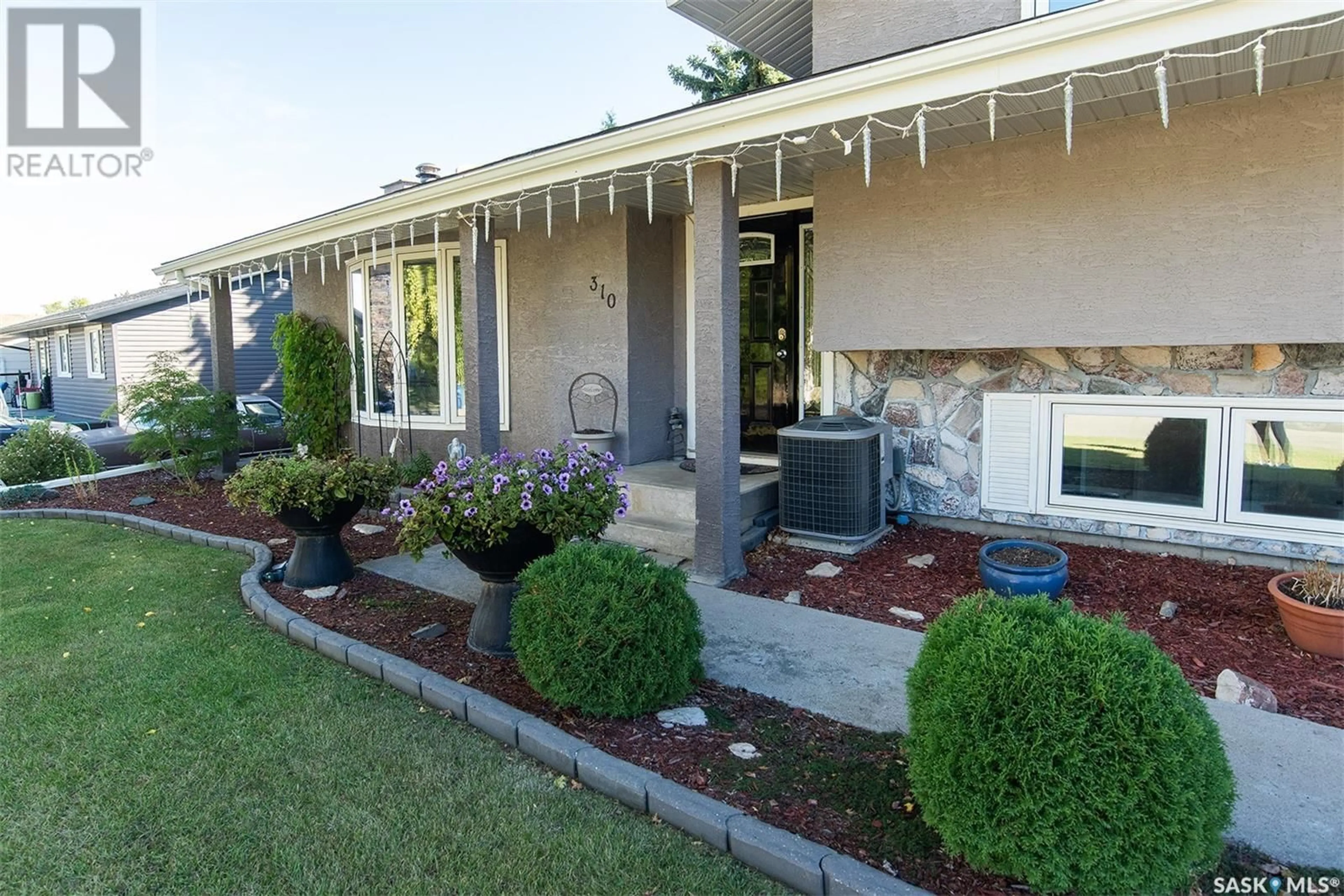 Frontside or backside of a home for 310 8th STREET E, Wynyard Saskatchewan S0A4T0