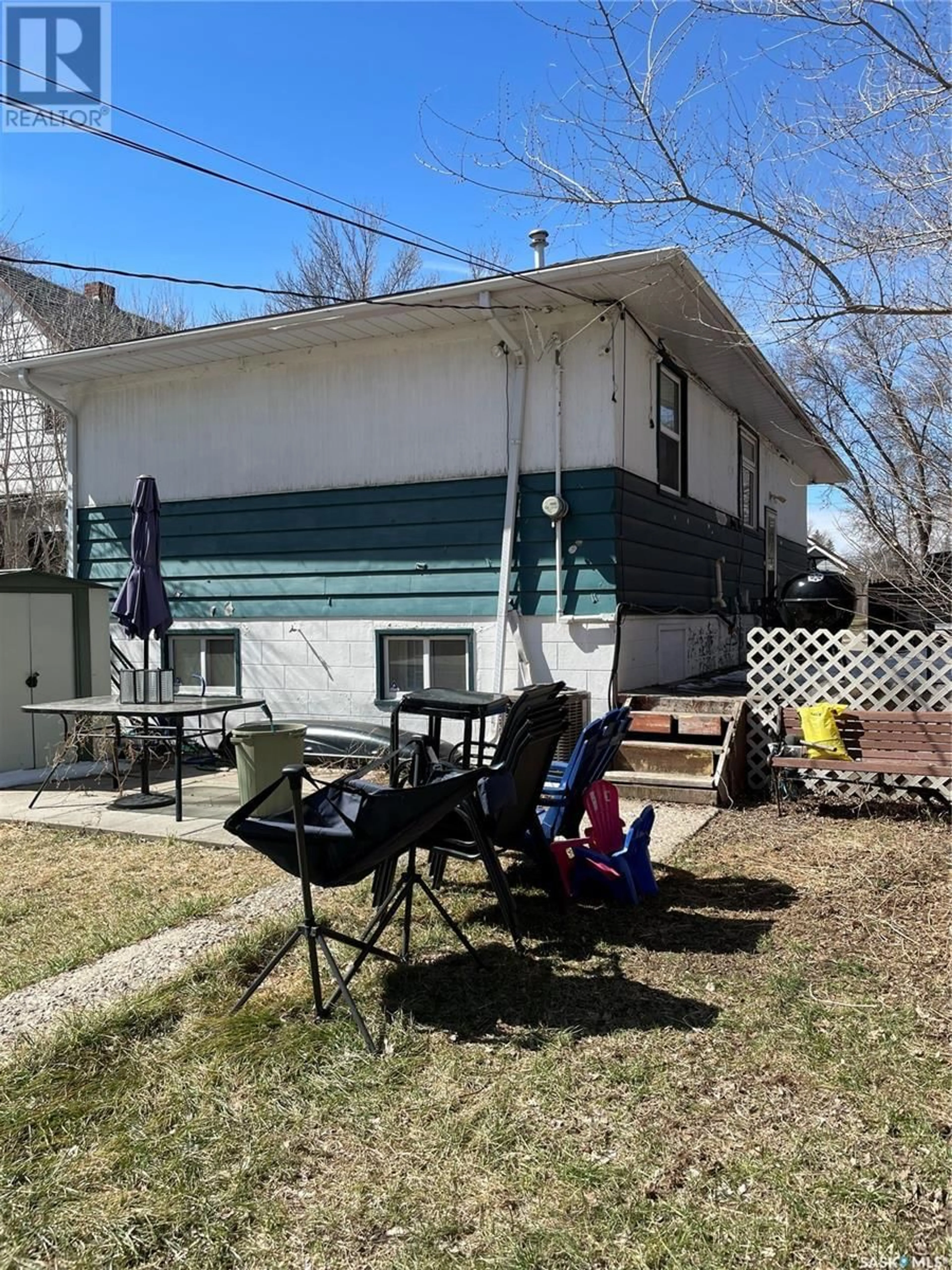 Frontside or backside of a home, the fenced backyard for 340 U AVENUE S, Saskatoon Saskatchewan S7M3C2