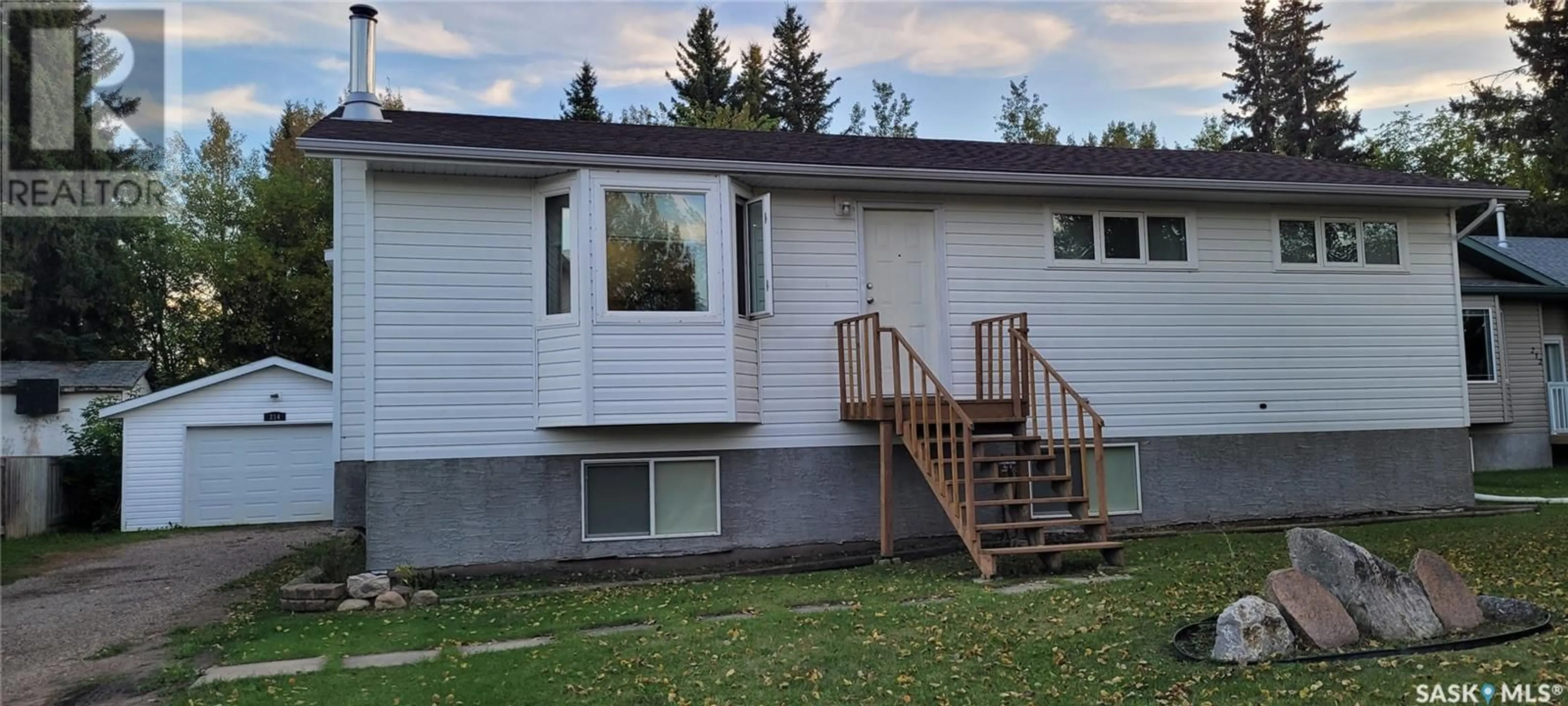 Home with vinyl exterior material, street for 214 CENTRE AVENUE, Meadow Lake Saskatchewan S9X1H2