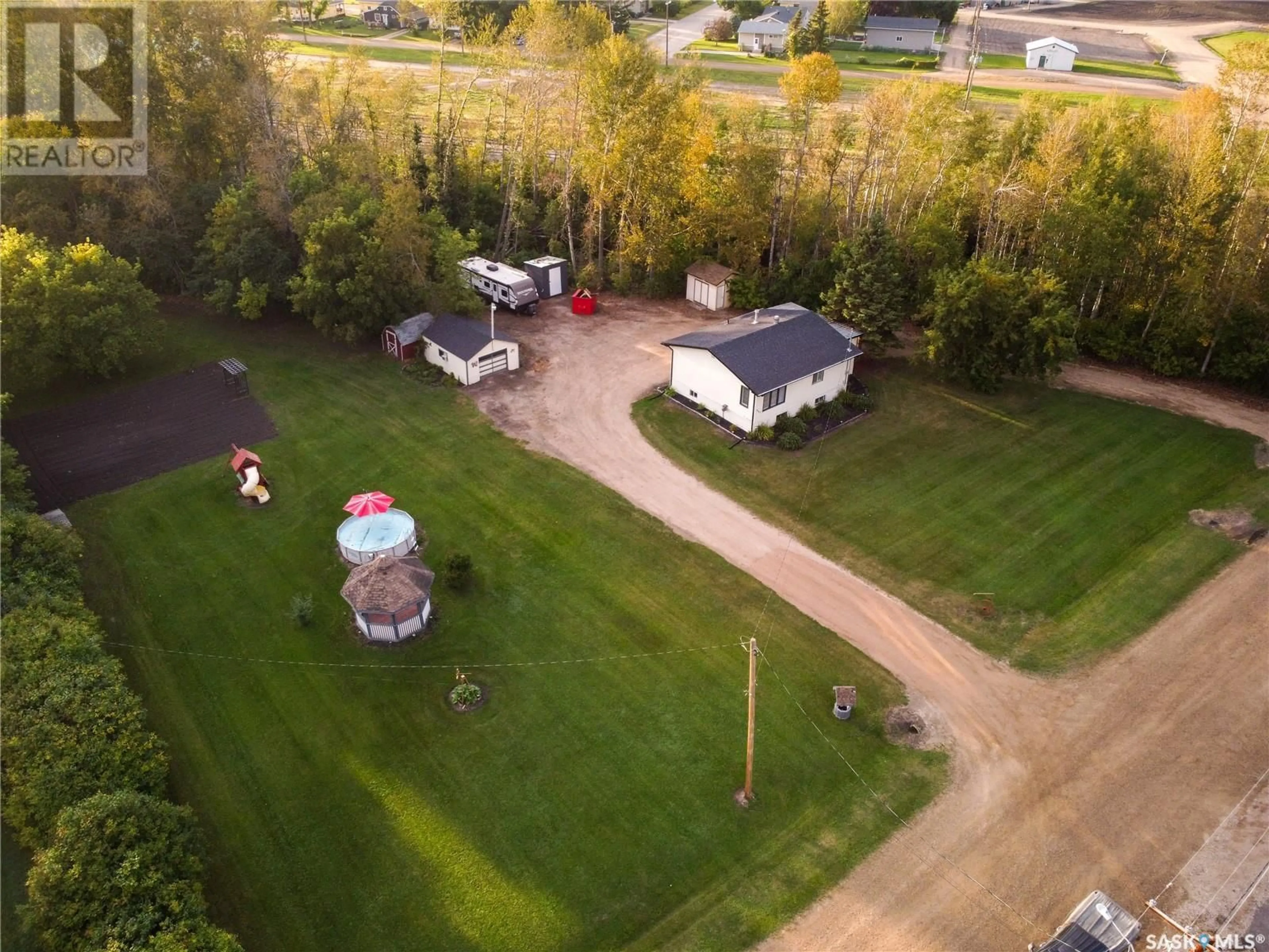 Frontside or backside of a home, the fenced backyard for 507 Parkdale STREET, Carrot River Saskatchewan S0E0L0