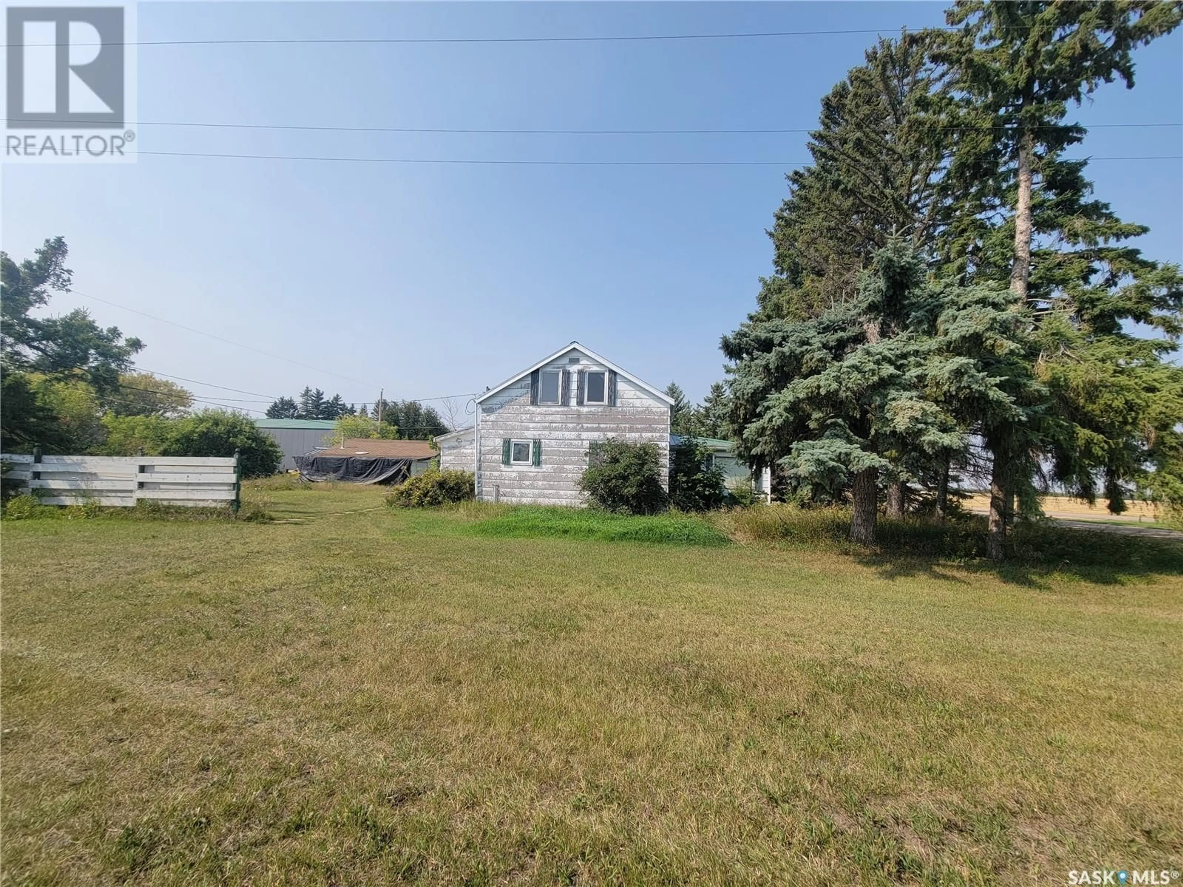 Frontside or backside of a home, the fenced backyard for 19 Railway AVENUE, Delmas Saskatchewan S0M0P0