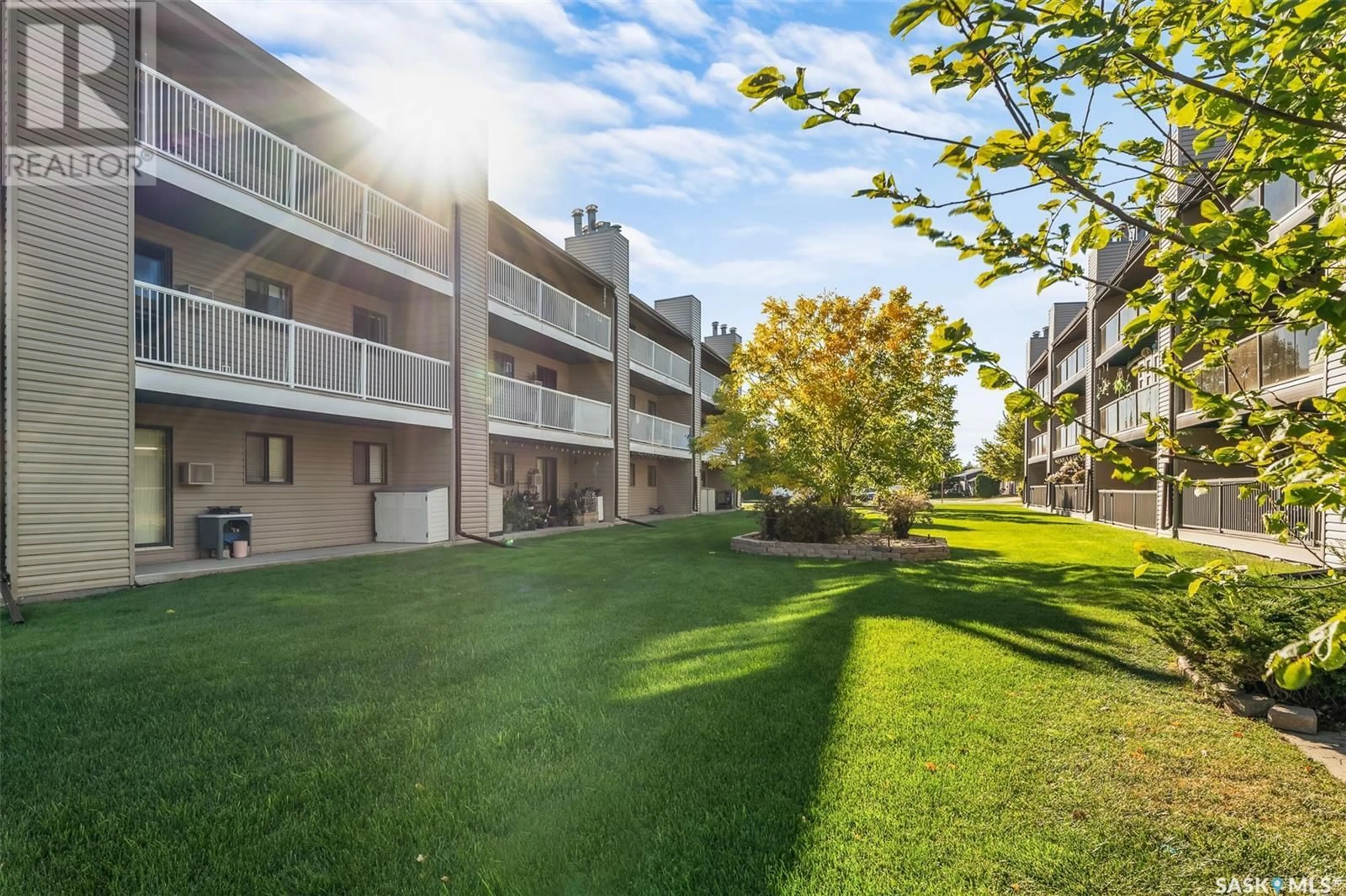 A pic from exterior of the house or condo, the fenced backyard for 206 55 Wood lily DRIVE, Moose Jaw Saskatchewan S6J1H1