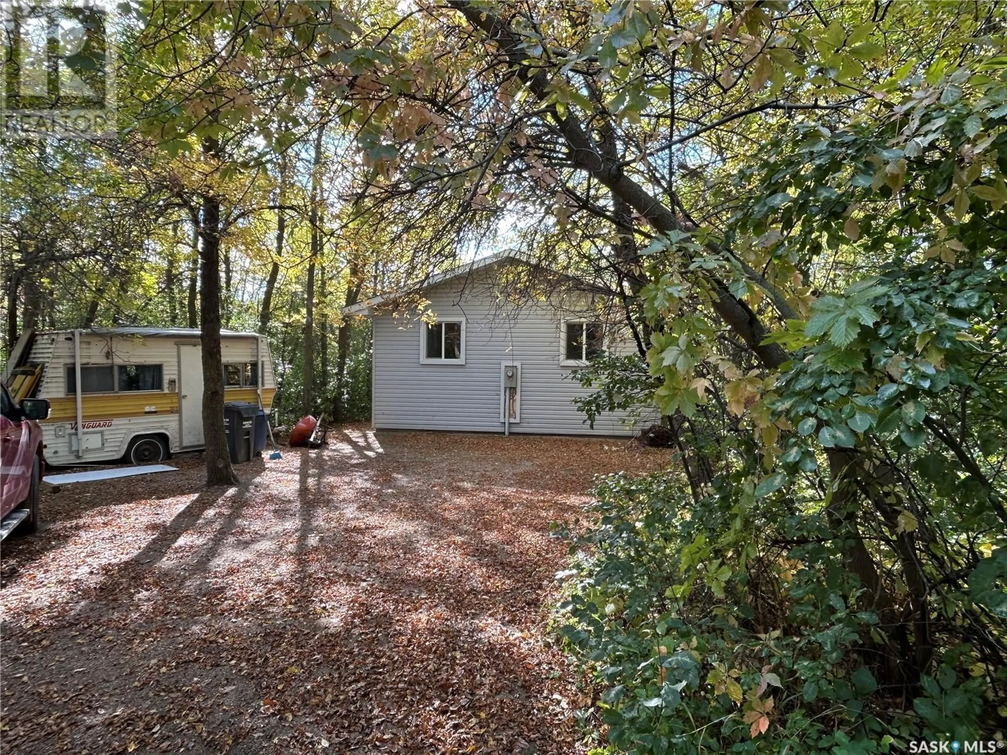 A pic from outside/outdoor area/front of a property/back of a property/a pic from drone, forest/trees view for 142 GARWELL DRIVE, Buffalo Pound Lake Saskatchewan S0H0H0