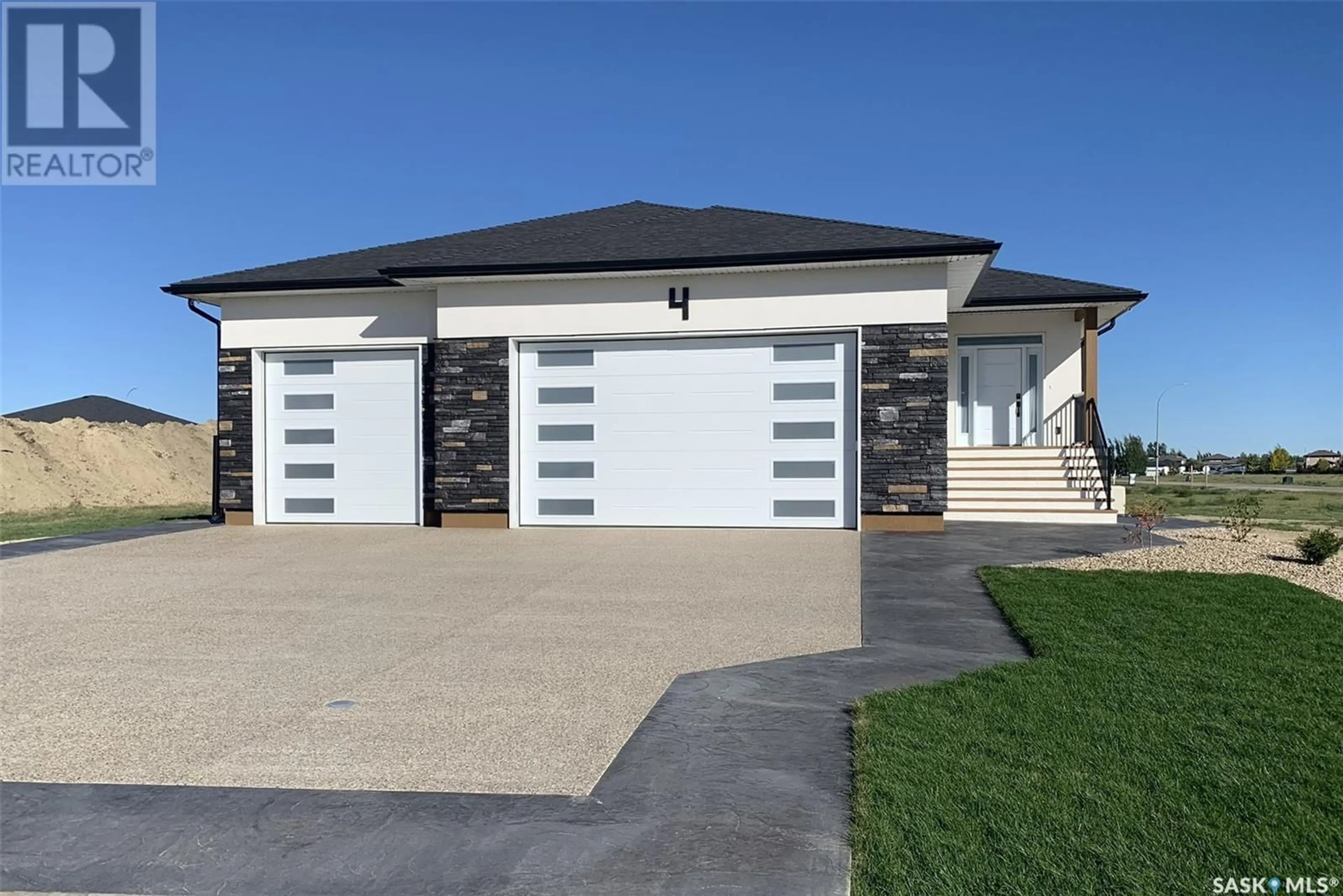 Frontside or backside of a home for 4 Huber BAY, Emerald Park Saskatchewan S4L0E7