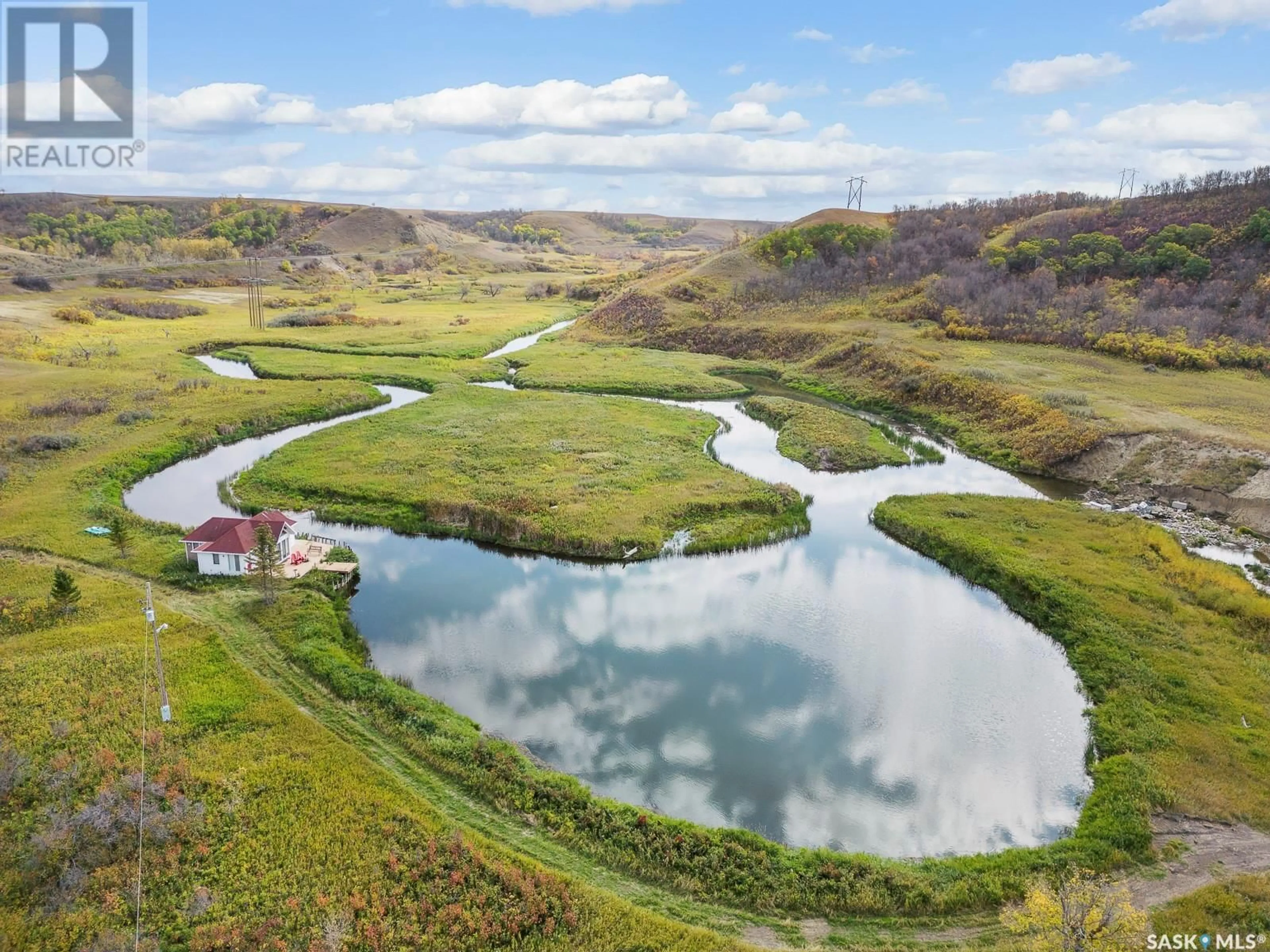 A pic from outside/outdoor area/front of a property/back of a property/a pic from drone, water/lake/river/ocean view for RIPPLINGER ACREAGE, Lumsden Rm No. 189 Saskatchewan S0G0W0