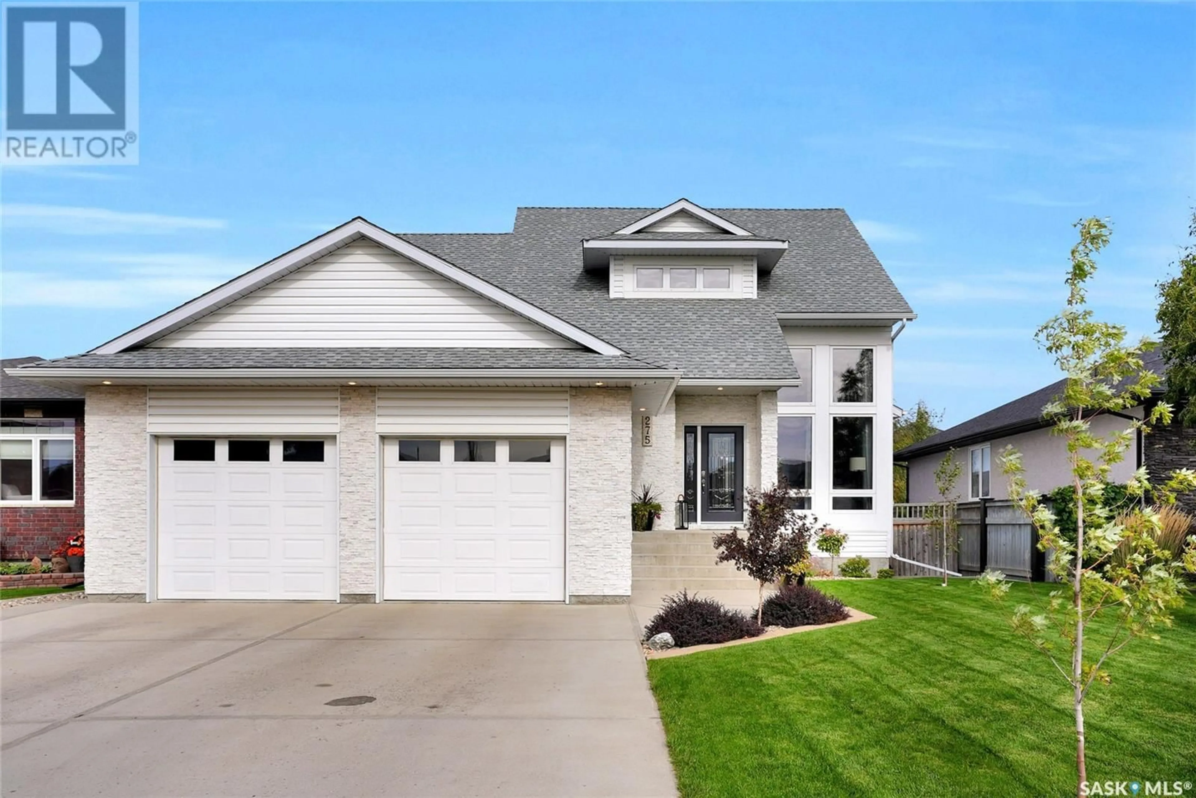 Home with vinyl exterior material for 275 Blue Sage DRIVE, Moose Jaw Saskatchewan S6J1N5