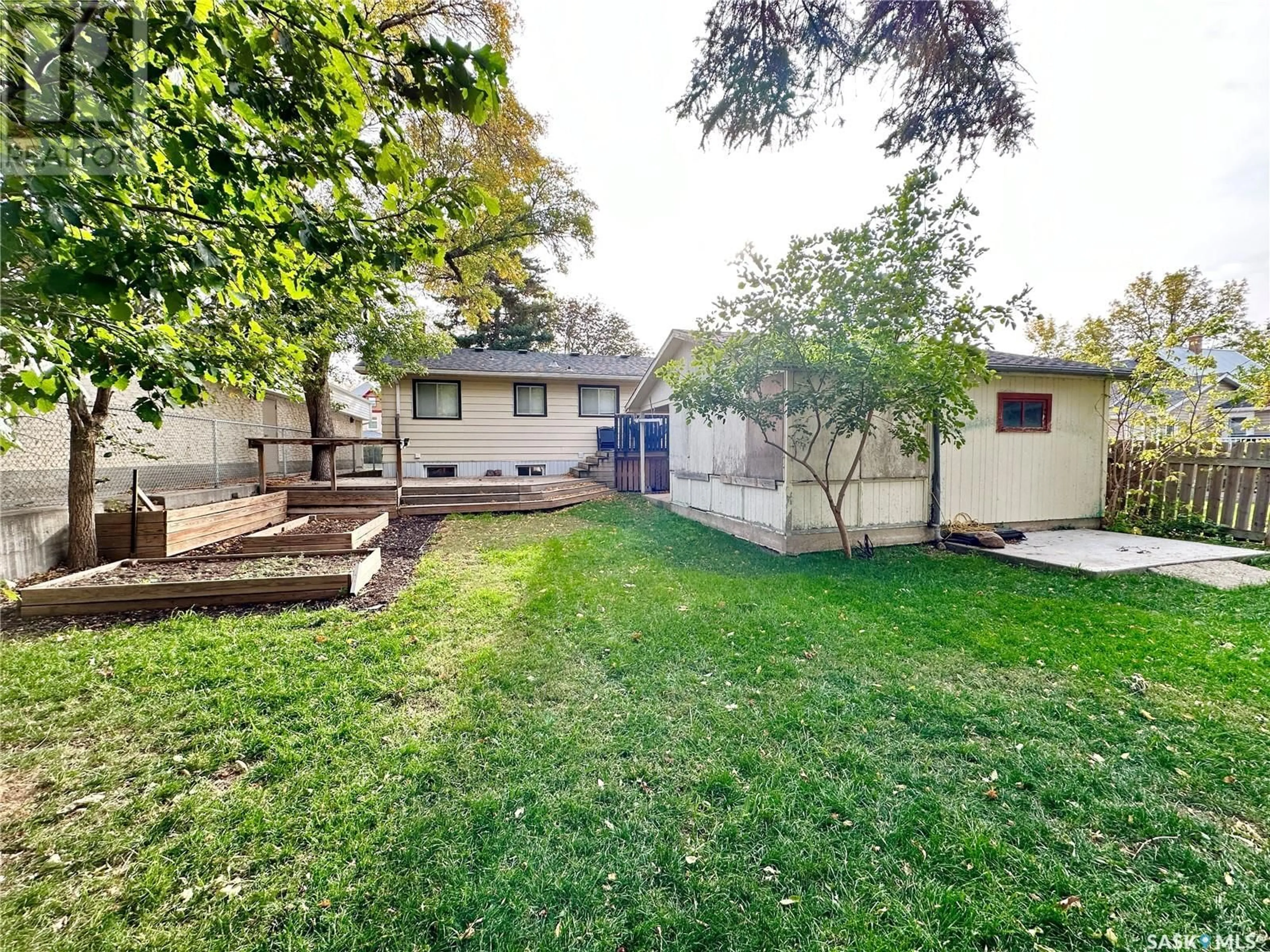 Frontside or backside of a home, the fenced backyard for 223 4TH STREET, Weyburn Saskatchewan S4H0Y4