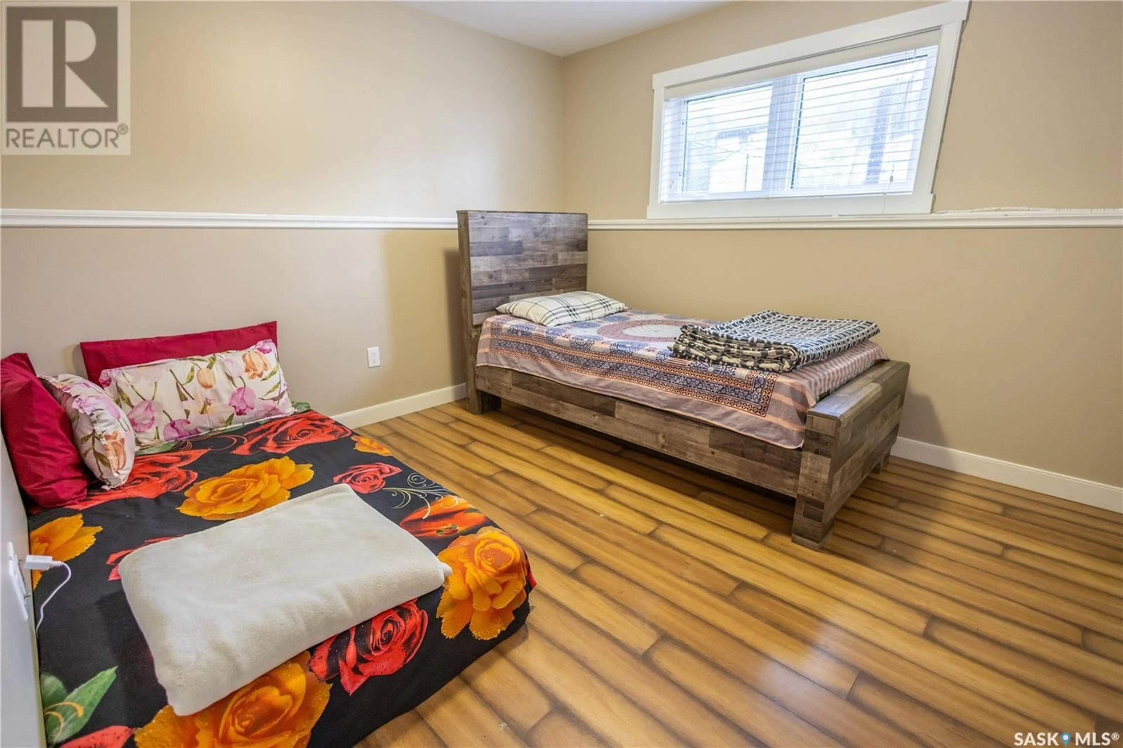 Bedroom with bed, wood/laminate floor for 15 HADLEY ROAD, Prince Albert Saskatchewan S6X0A5