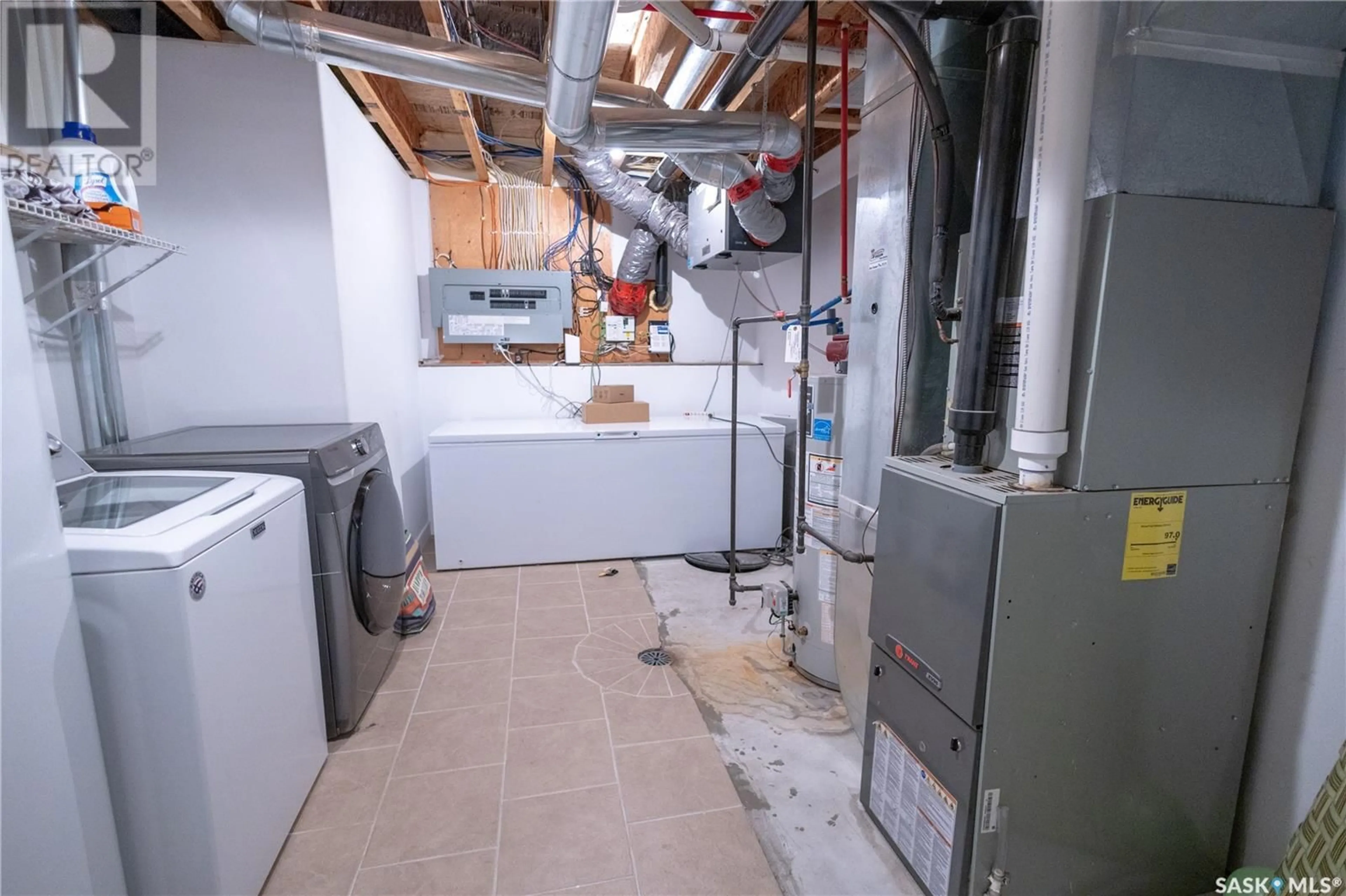 Kitchen with laundary machines, floor is not visible for 15 HADLEY ROAD, Prince Albert Saskatchewan S6X0A5