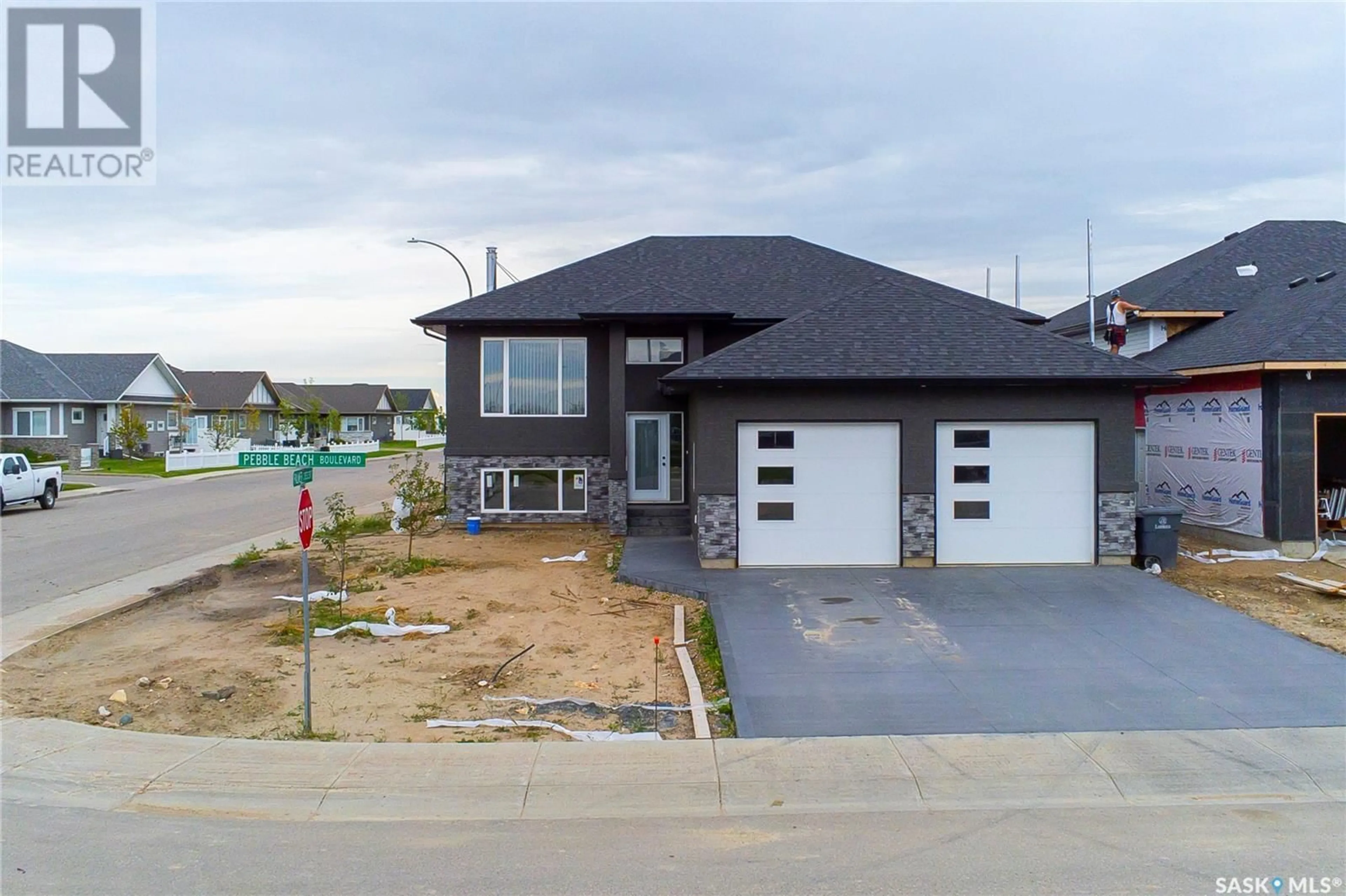 Frontside or backside of a home for 613 Pebble Beach BOULEVARD, Warman Saskatchewan S0K4S1