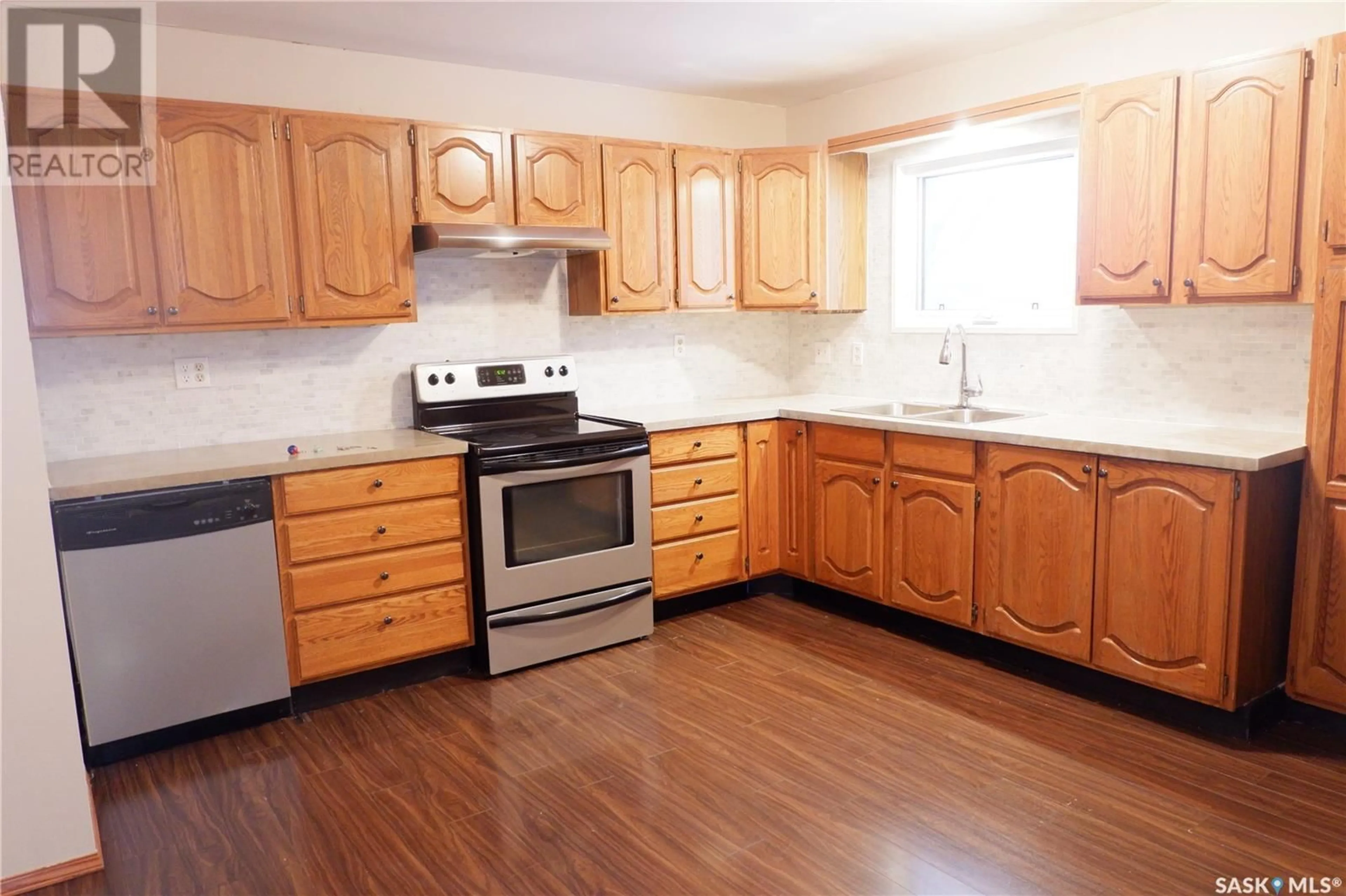 Standard kitchen, wood floors, cottage for 243 Dominion ROAD, Assiniboia Saskatchewan S0H0B0