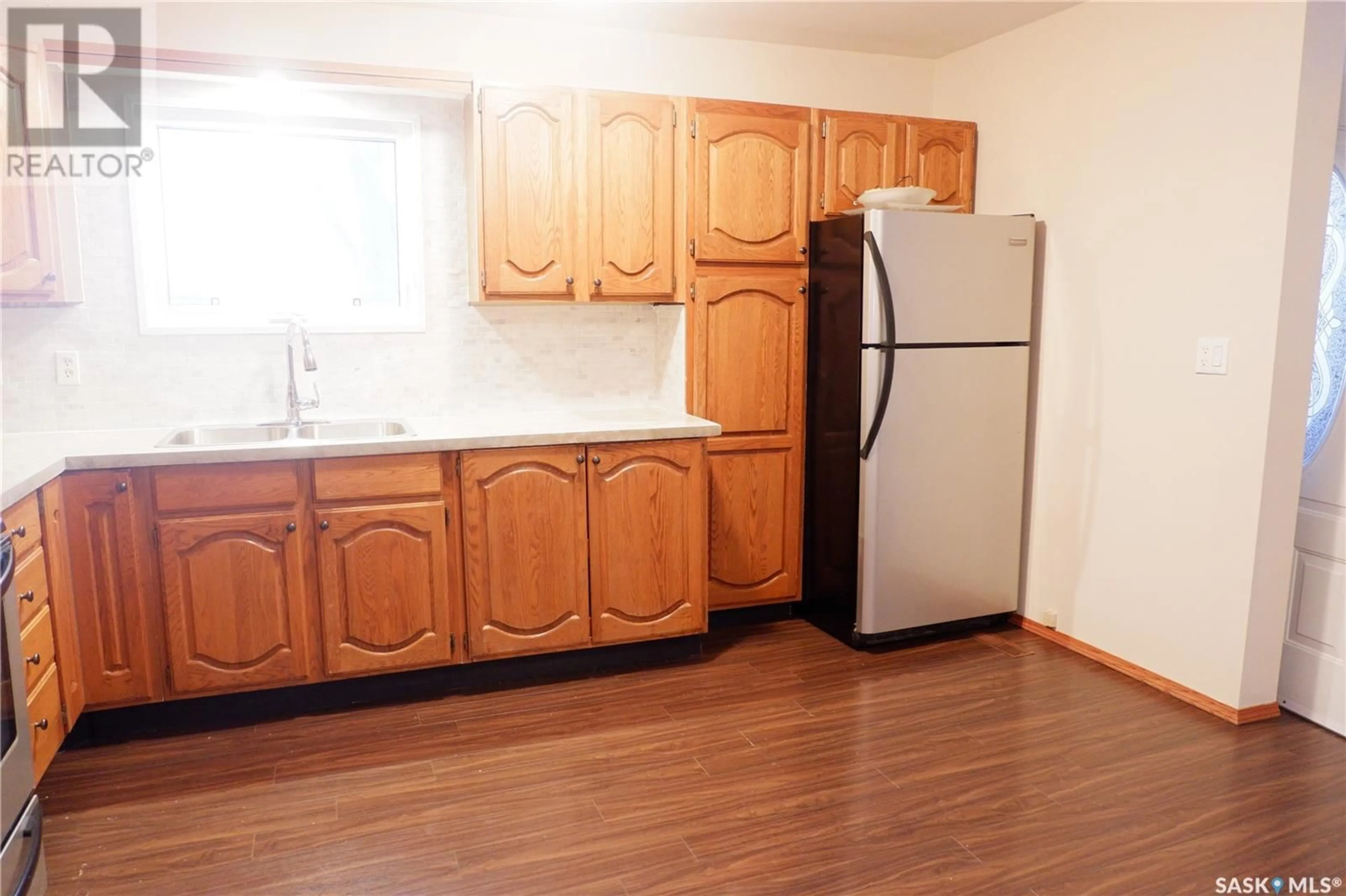 Standard kitchen, wood floors, cottage for 243 Dominion ROAD, Assiniboia Saskatchewan S0H0B0