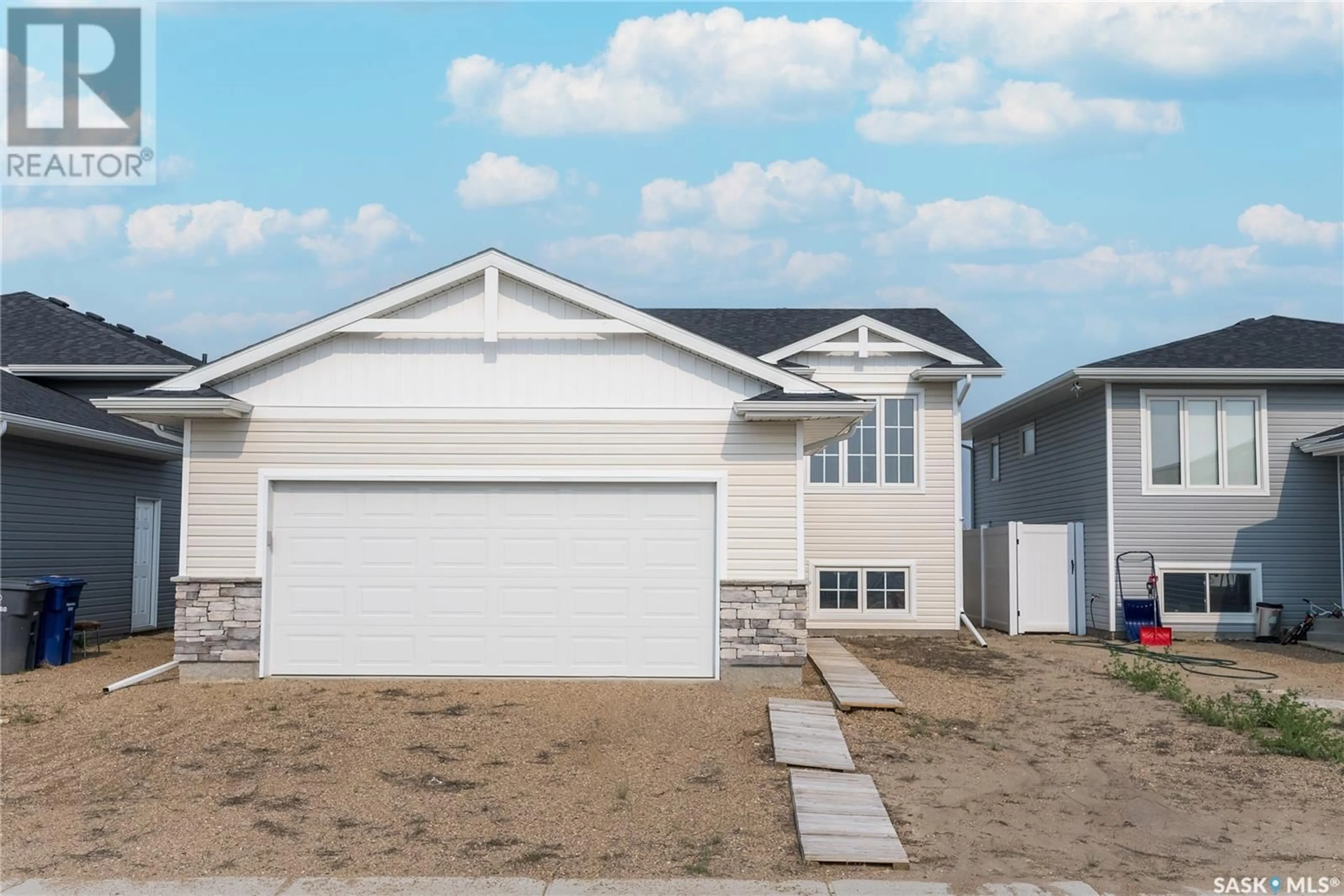 Frontside or backside of a home for 524 Froese STREET, Warman Saskatchewan S0K4S3