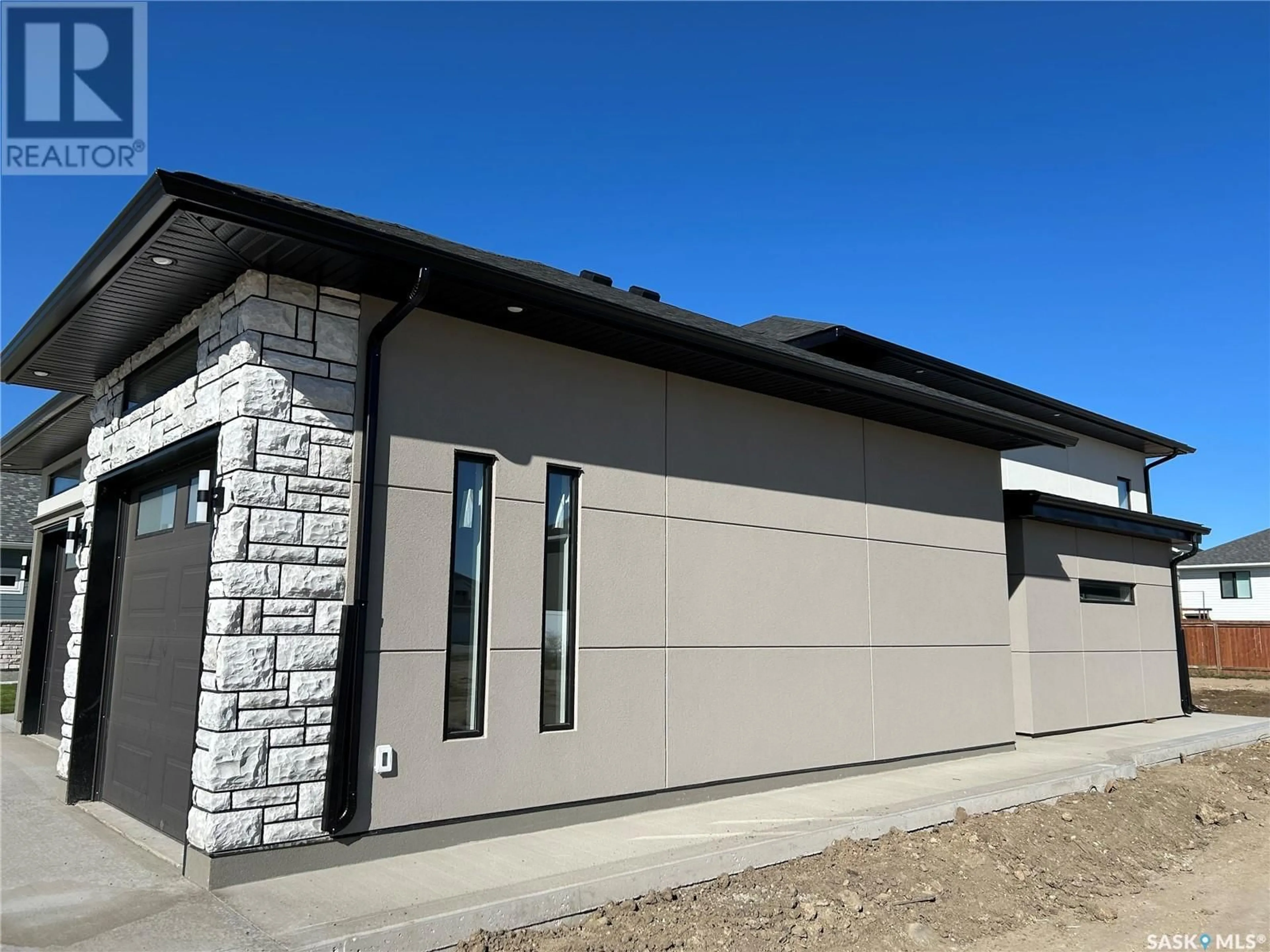 Home with vinyl exterior material for 400 Clubhouse BOULEVARD, Warman Saskatchewan S0K0A1