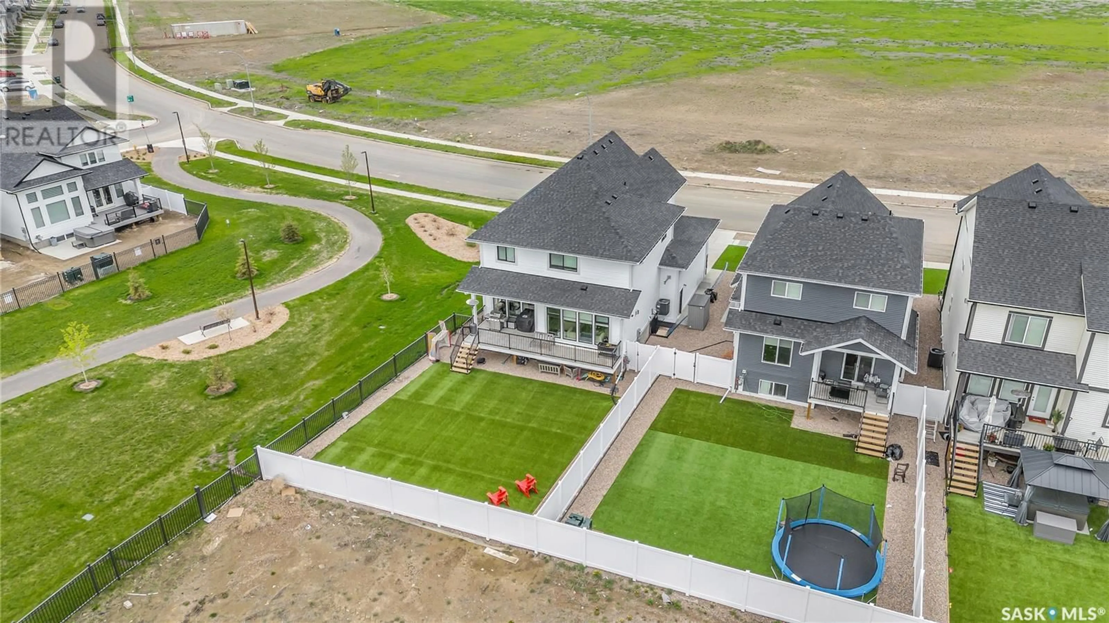 Frontside or backside of a home, the fenced backyard for 904 Feheregyhazi BOULEVARD, Saskatoon Saskatchewan S7W1E1