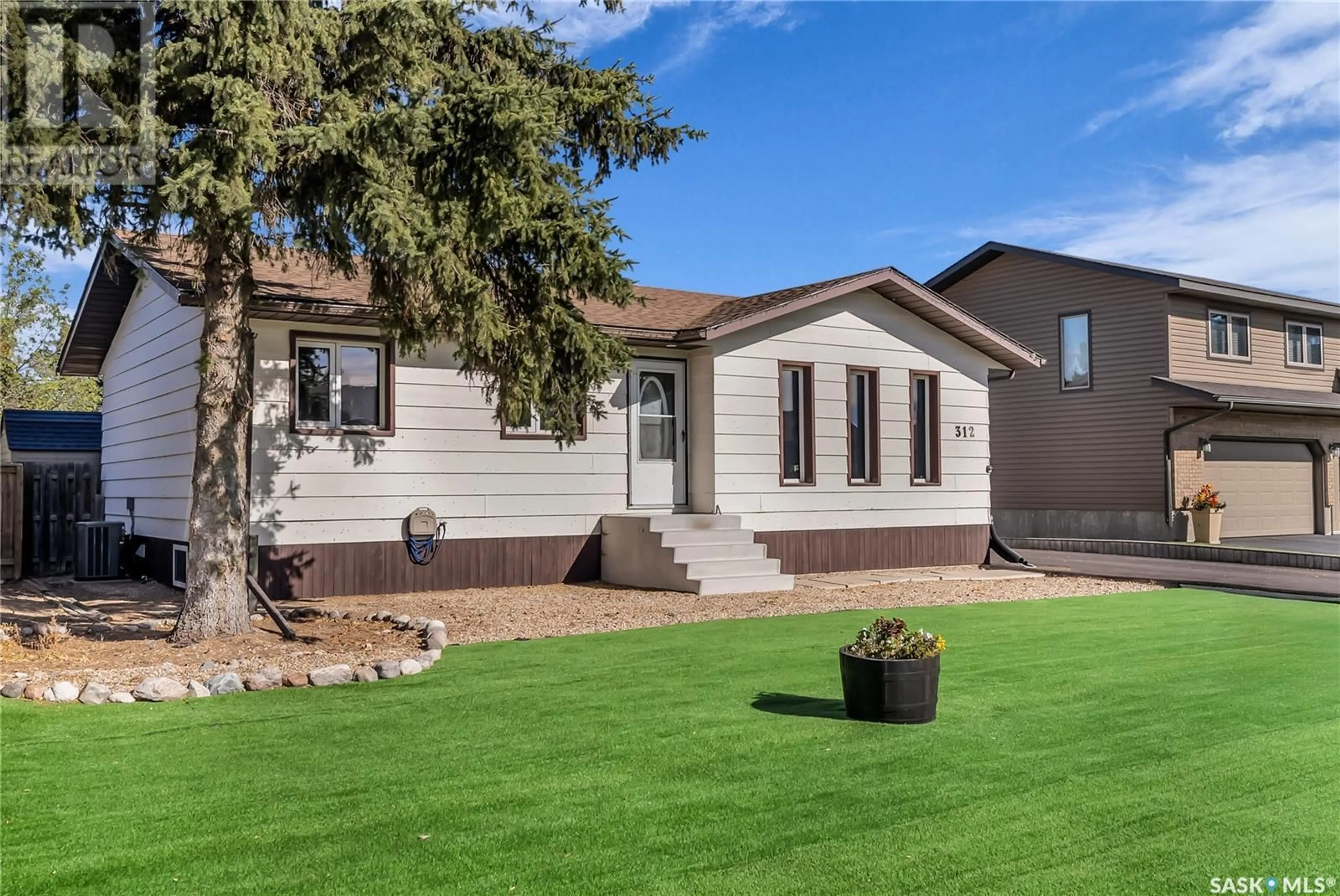 Frontside or backside of a home, the fenced backyard for 312 7th AVENUE W, Watrous Saskatchewan S0K4T0