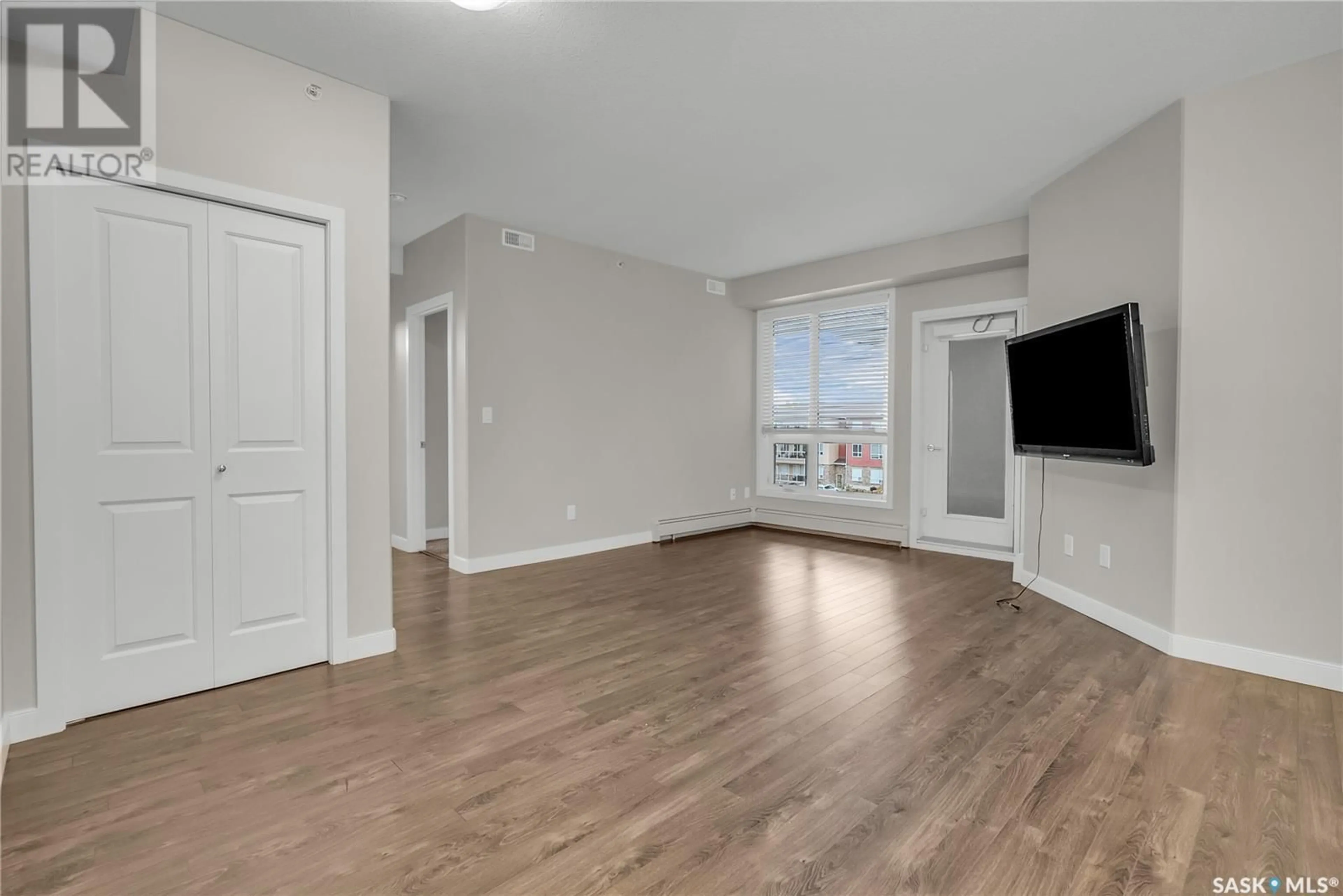 A pic of a room, wood floors for 302 1025 Moss AVENUE, Saskatoon Saskatchewan S7H4C7