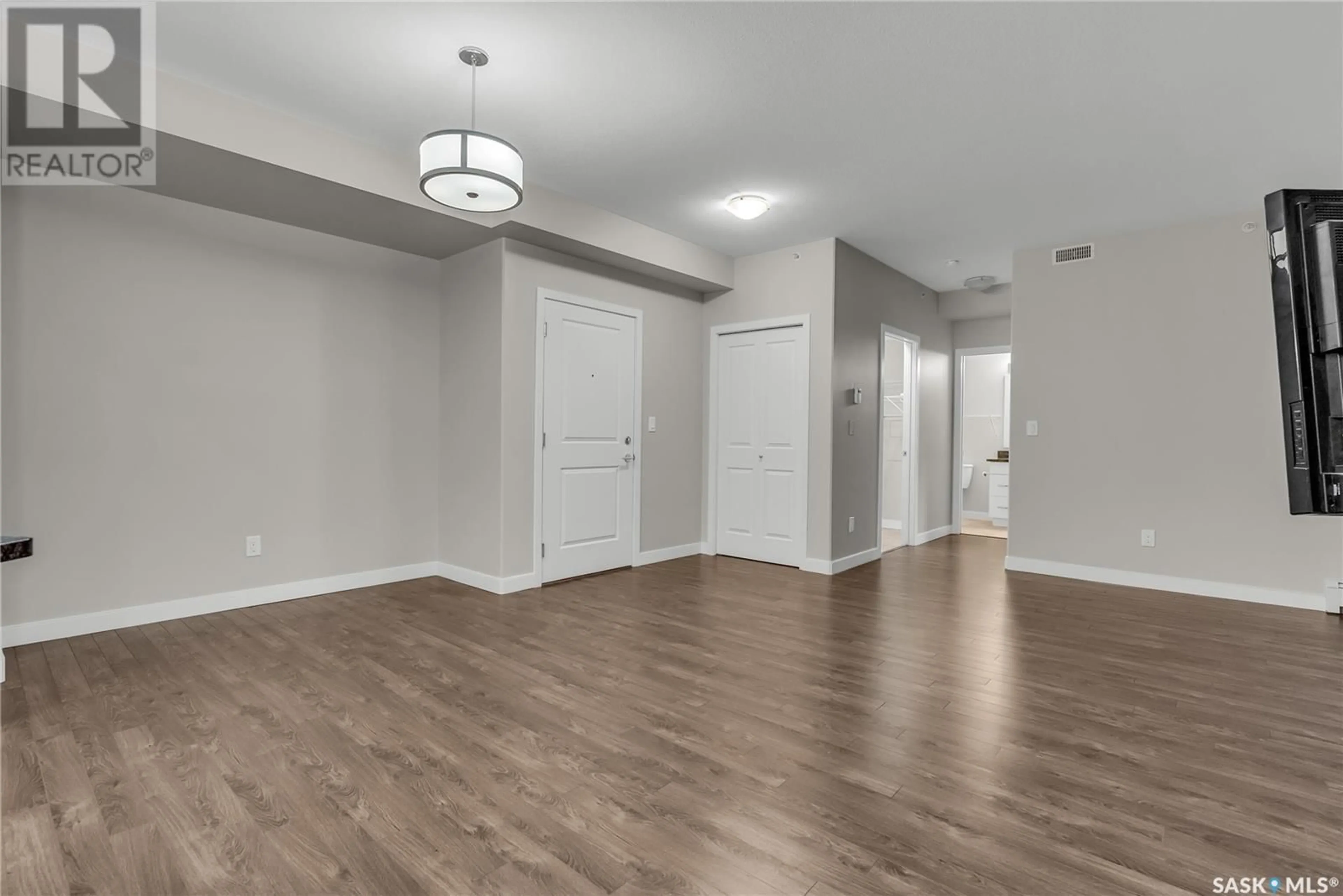 A pic of a room, wood floors for 302 1025 Moss AVENUE, Saskatoon Saskatchewan S7H4C7