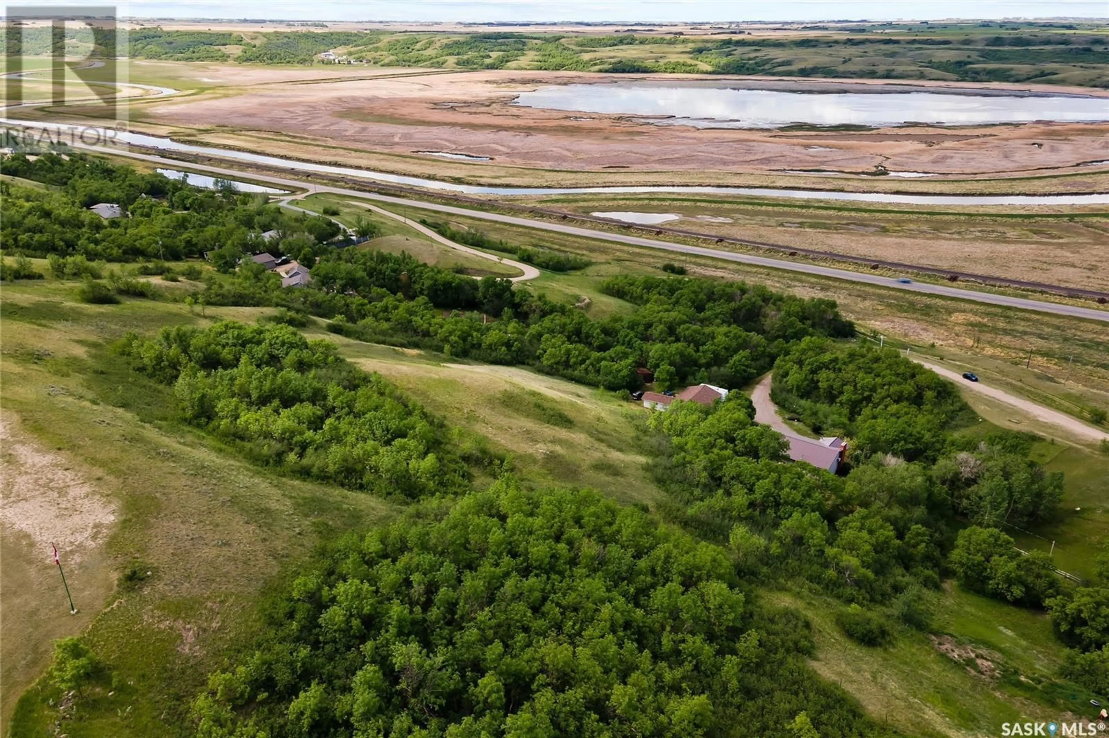 A pic from outside/outdoor area/front of a property/back of a property/a pic from drone, water/lake/river/ocean view for RM of Longlaketon No. 219 - Bechard ACREAGE, Longlaketon Rm No. 219 Saskatchewan S0G0W0