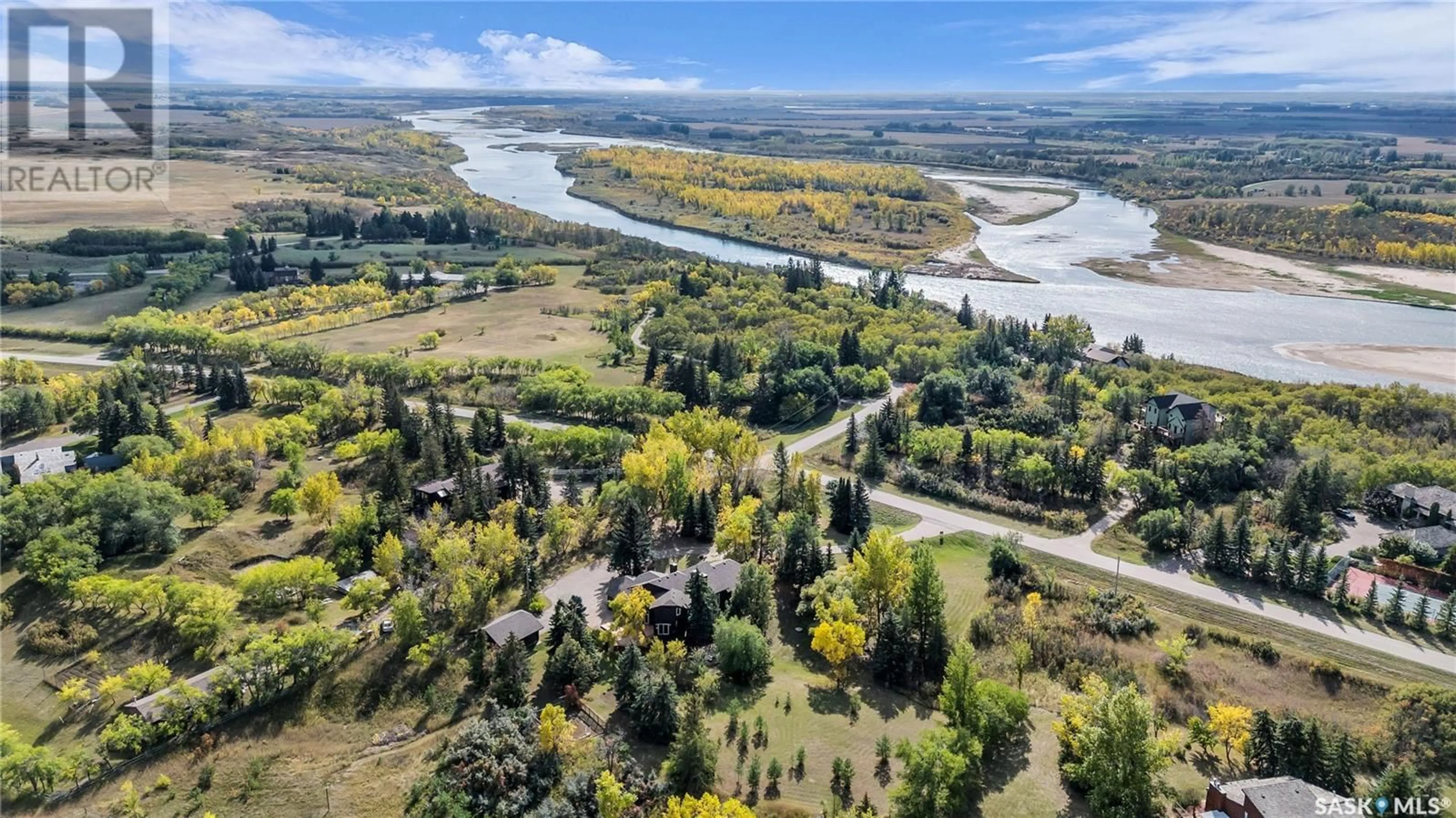 A pic from outside/outdoor area/front of a property/back of a property/a pic from drone, water/lake/river/ocean view for 25 Pony TRAIL, Riverside Estates Saskatchewan S7T1A2