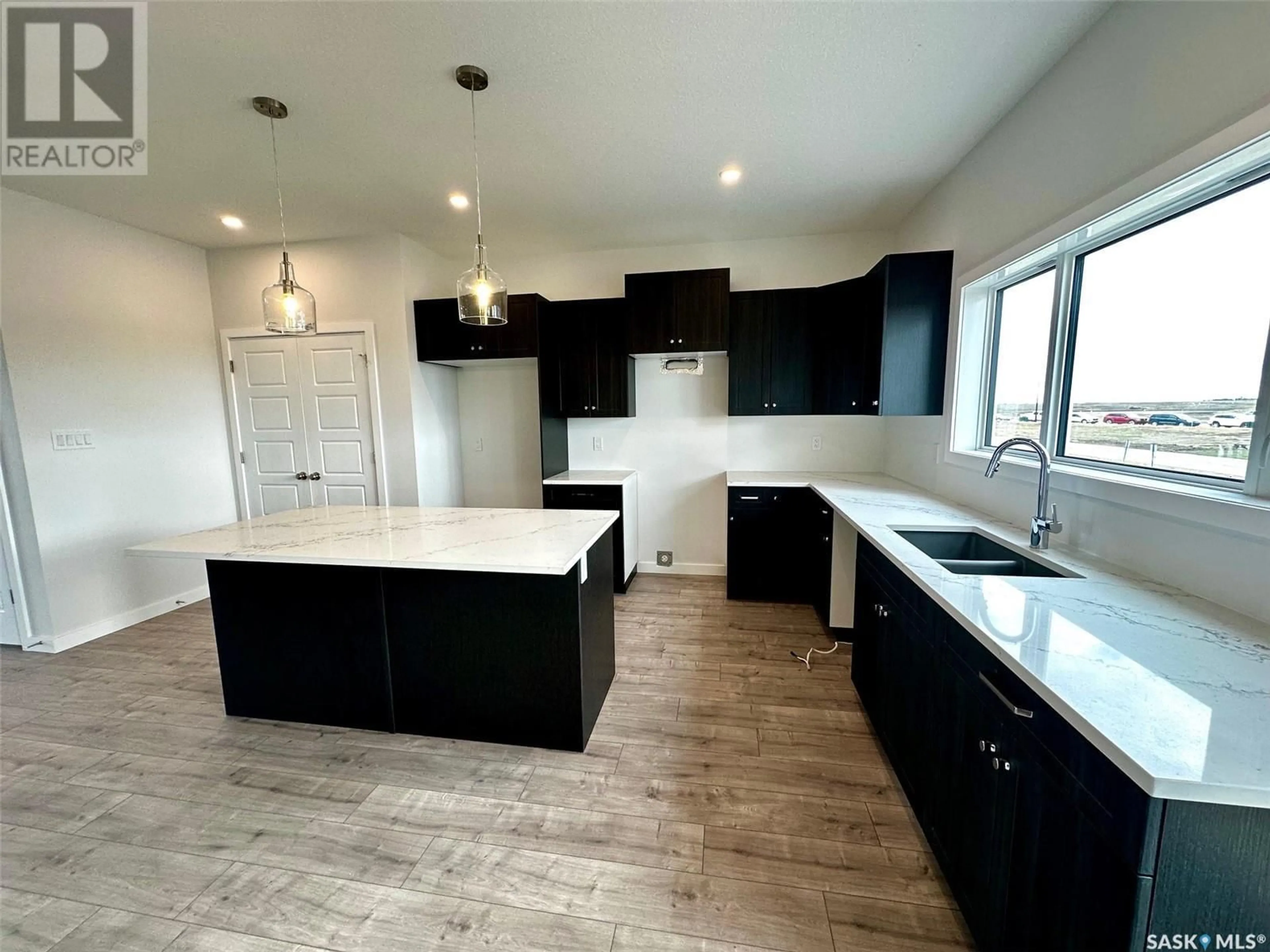 Open concept kitchen for 1125 Camden GARDENS, White City Saskatchewan S4L0G1