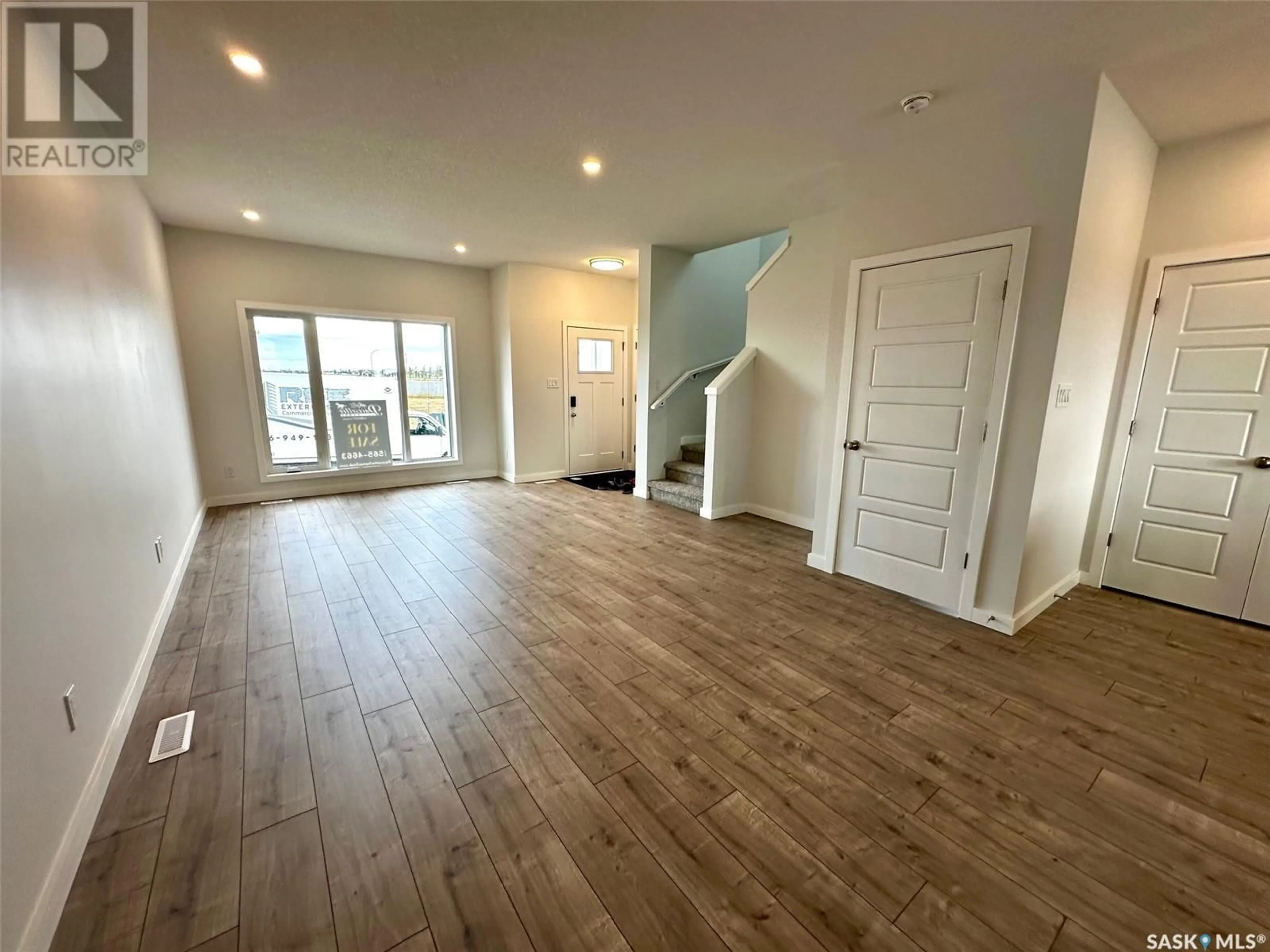 A pic of a room, wood floors for 1125 Camden GARDENS, White City Saskatchewan S4L0G1