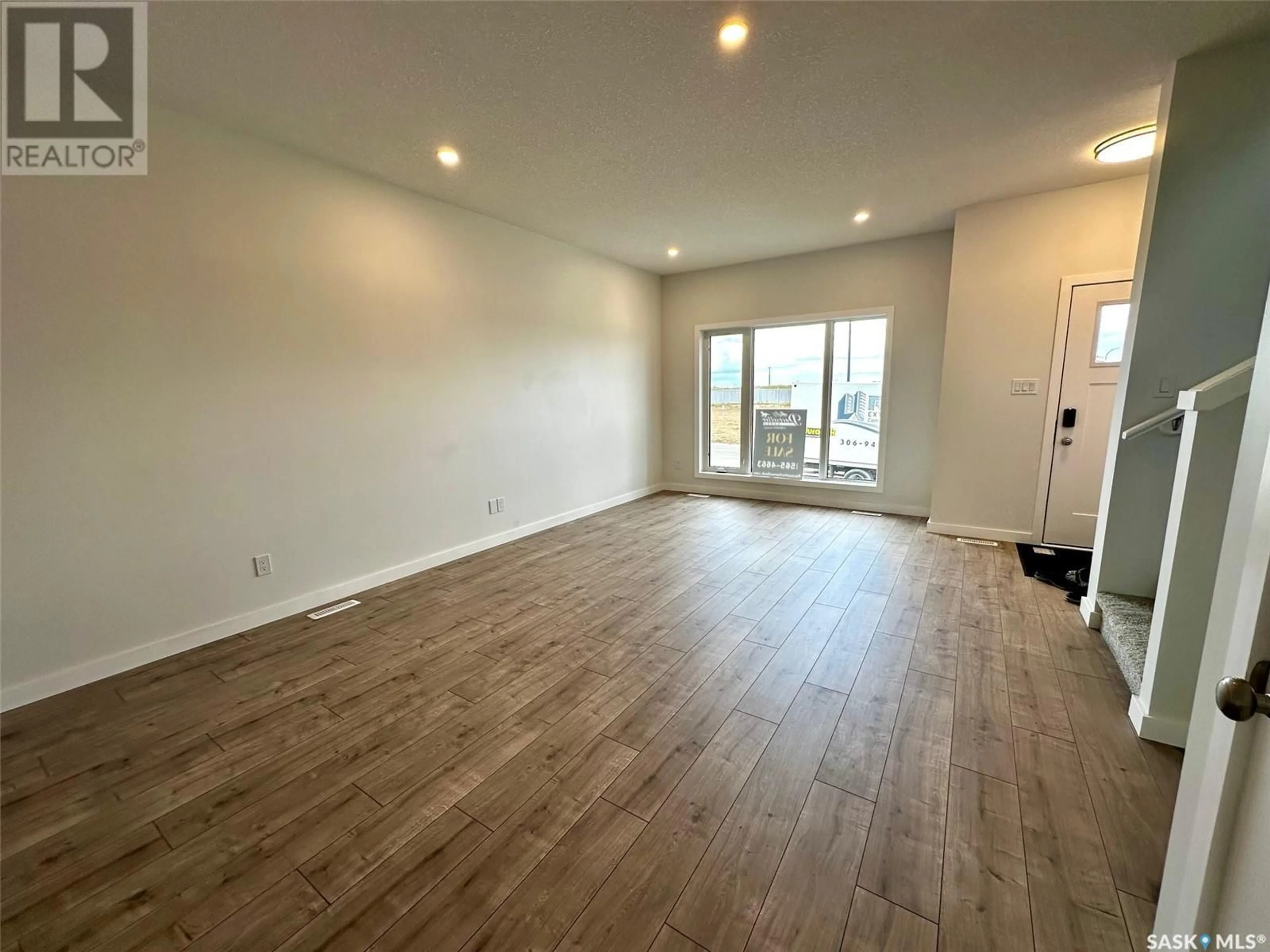 A pic of a room, wood floors for 1125 Camden GARDENS, White City Saskatchewan S4L0G1