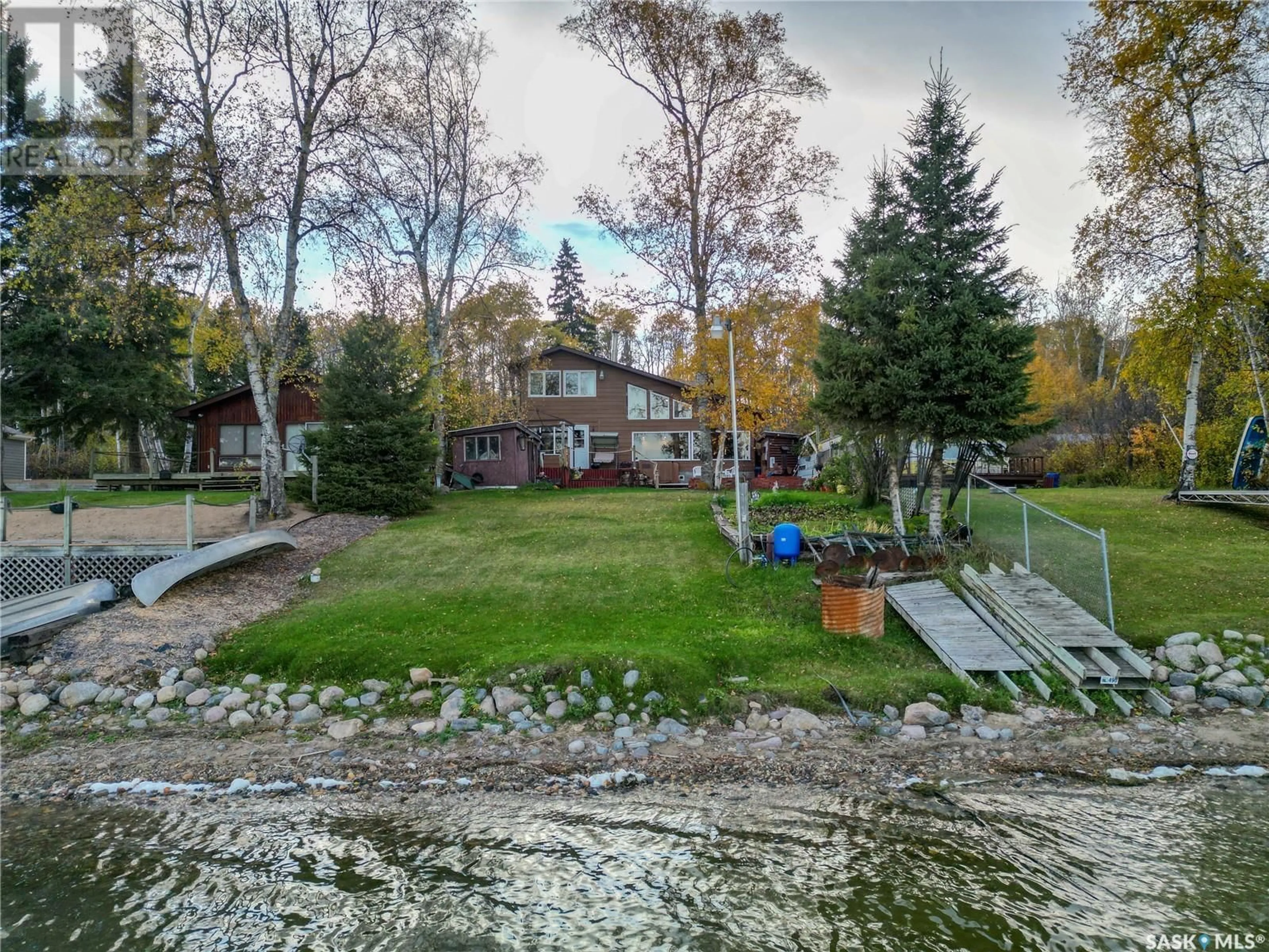 A pic from exterior of the house or condo, the fenced backyard for 331 Guise DRIVE, Emma Lake Saskatchewan S0J0N0