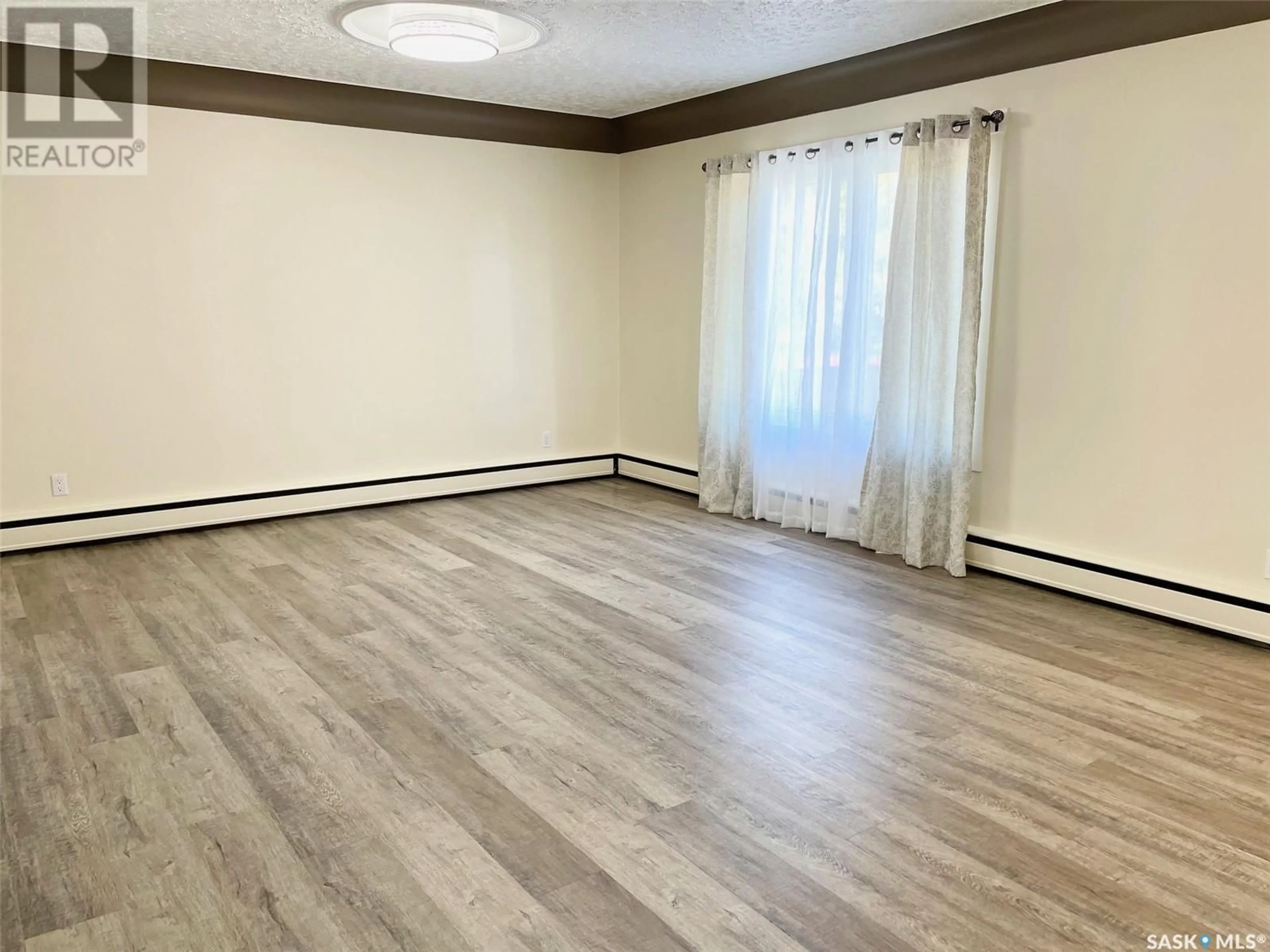 A pic of a room, wood floors for 100 Betts AVENUE, Yorkton Saskatchewan S3N1M3