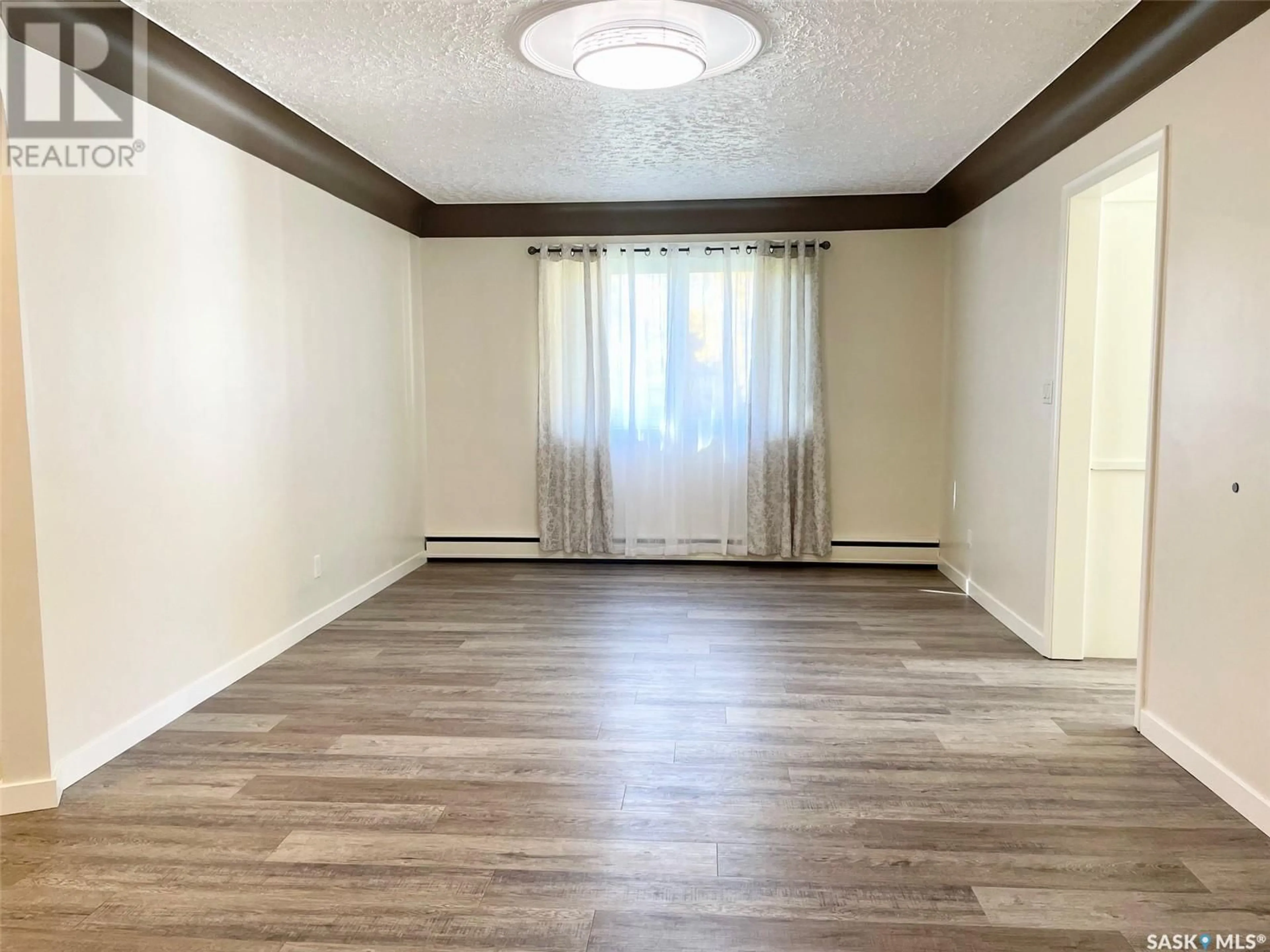 A pic of a room, wood floors for 100 Betts AVENUE, Yorkton Saskatchewan S3N1M3