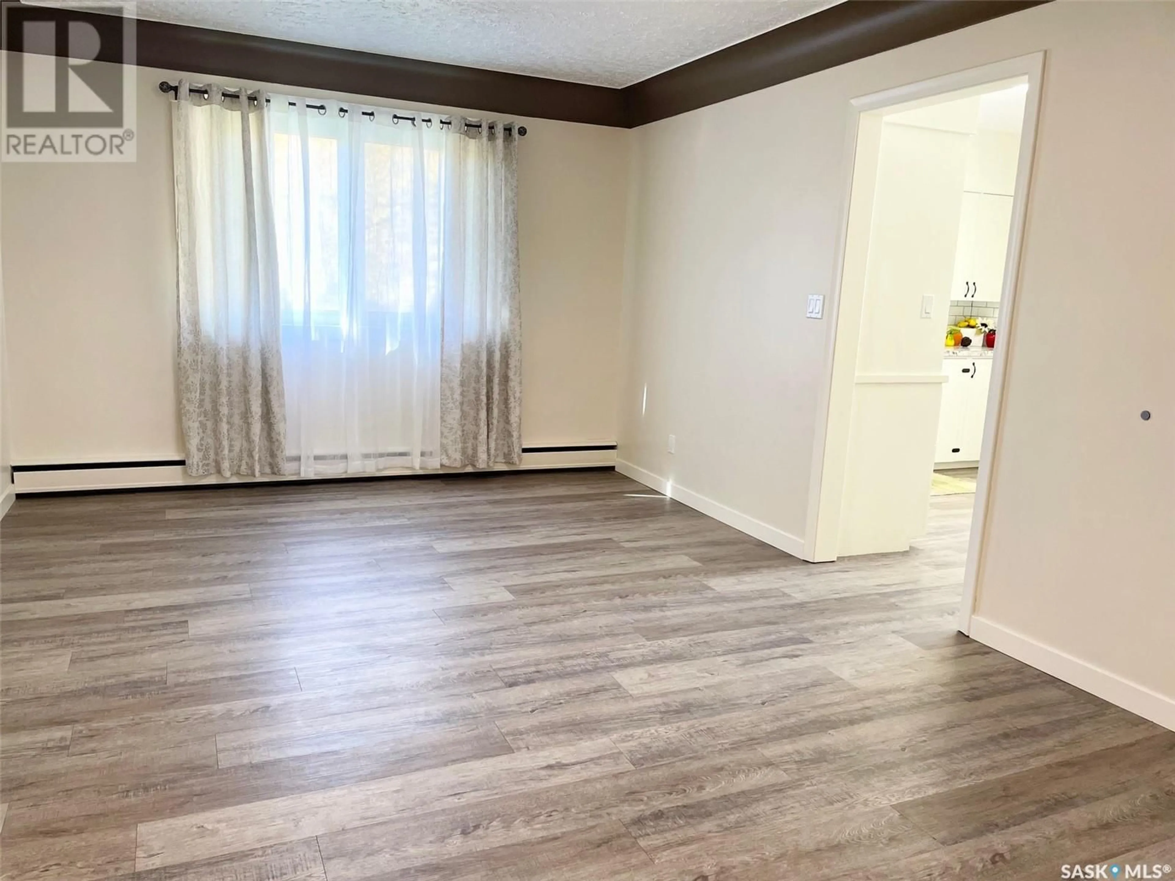 A pic of a room, wood floors for 100 Betts AVENUE, Yorkton Saskatchewan S3N1M3