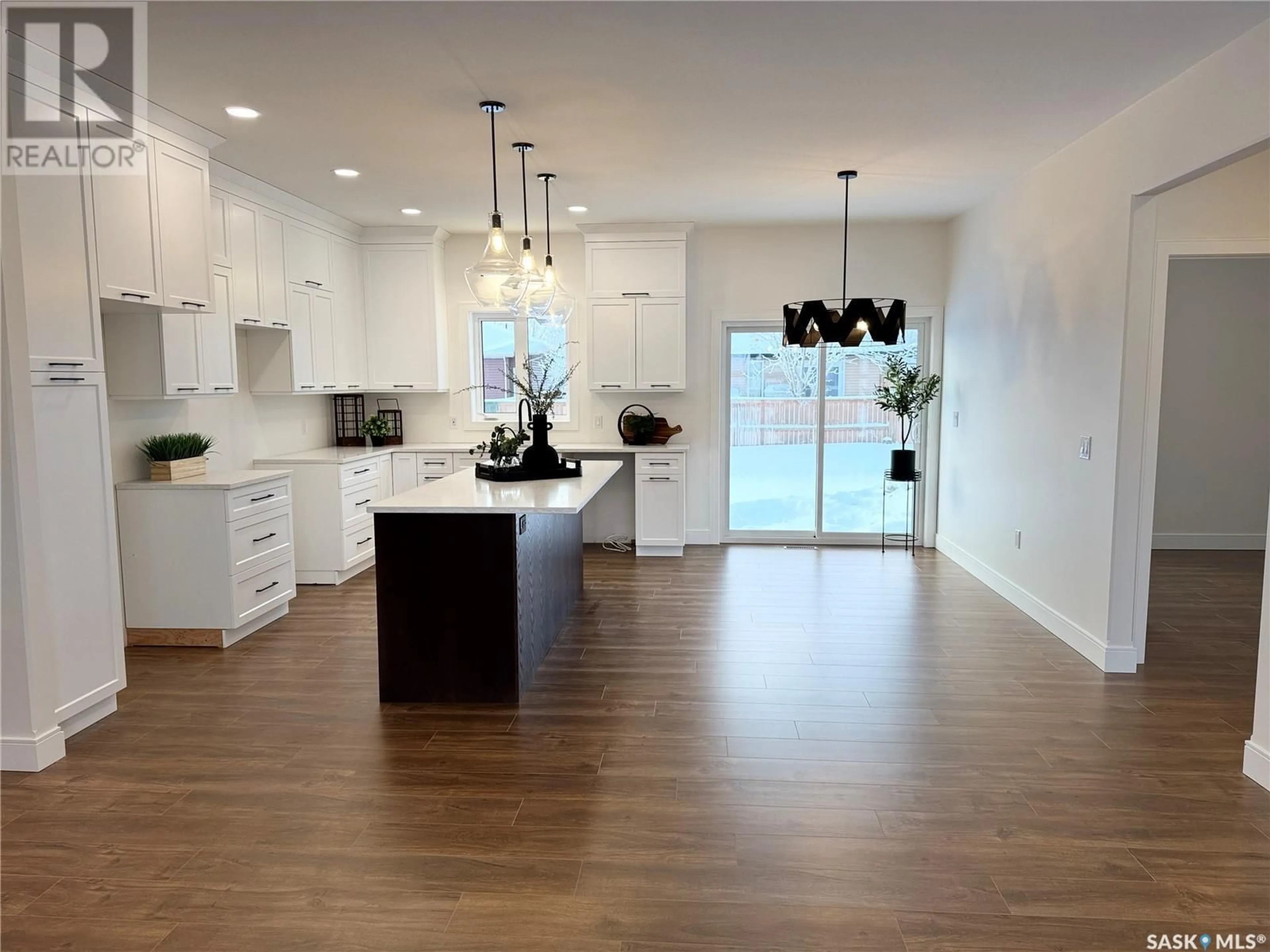 Open concept kitchen, wood/laminate floor for 92 101ST STREET, Humboldt Saskatchewan S0K2A0