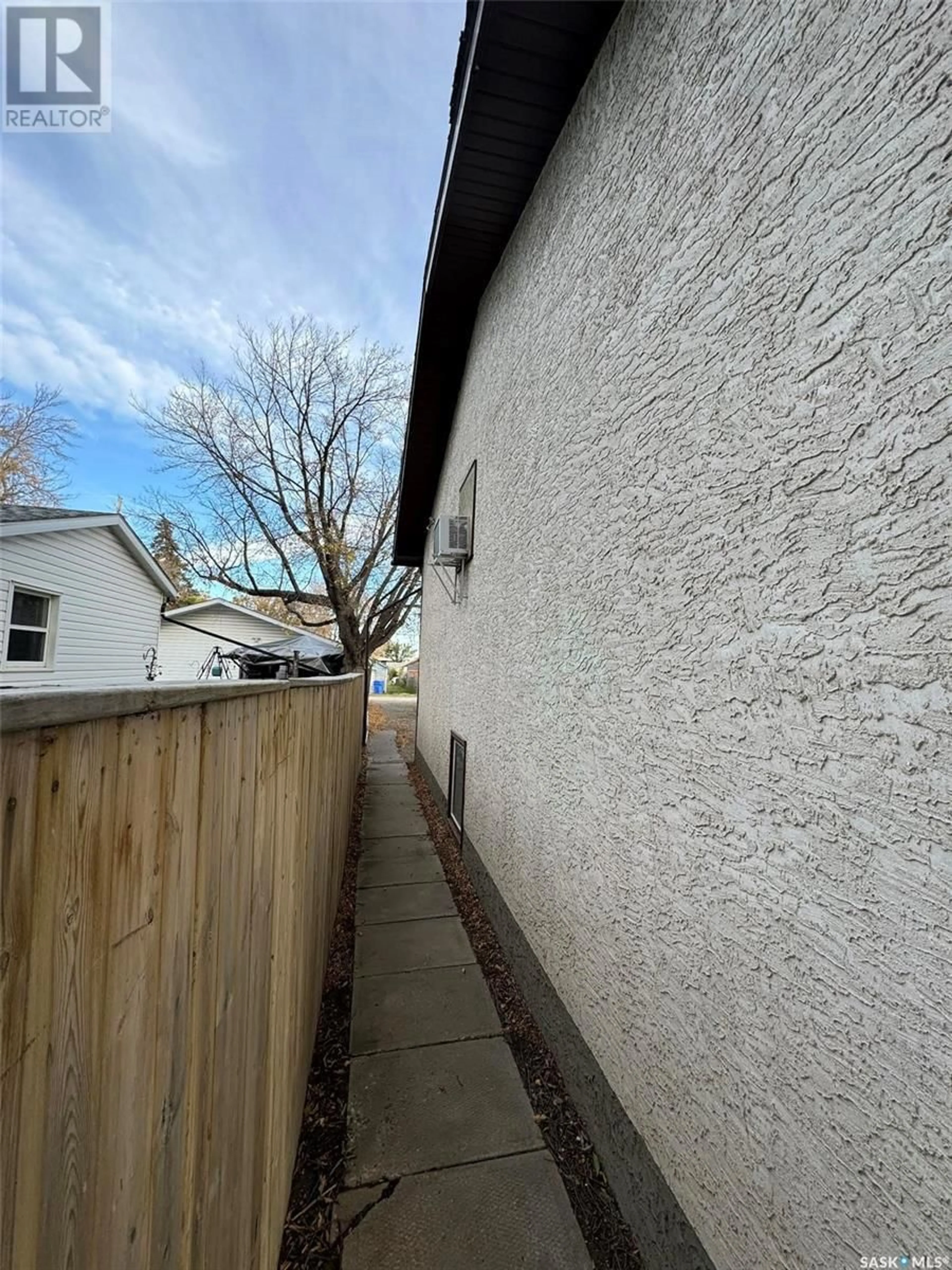 Frontside or backside of a home, the fenced backyard for A & B 345 SCARTH STREET, Regina Saskatchewan S4R2C4