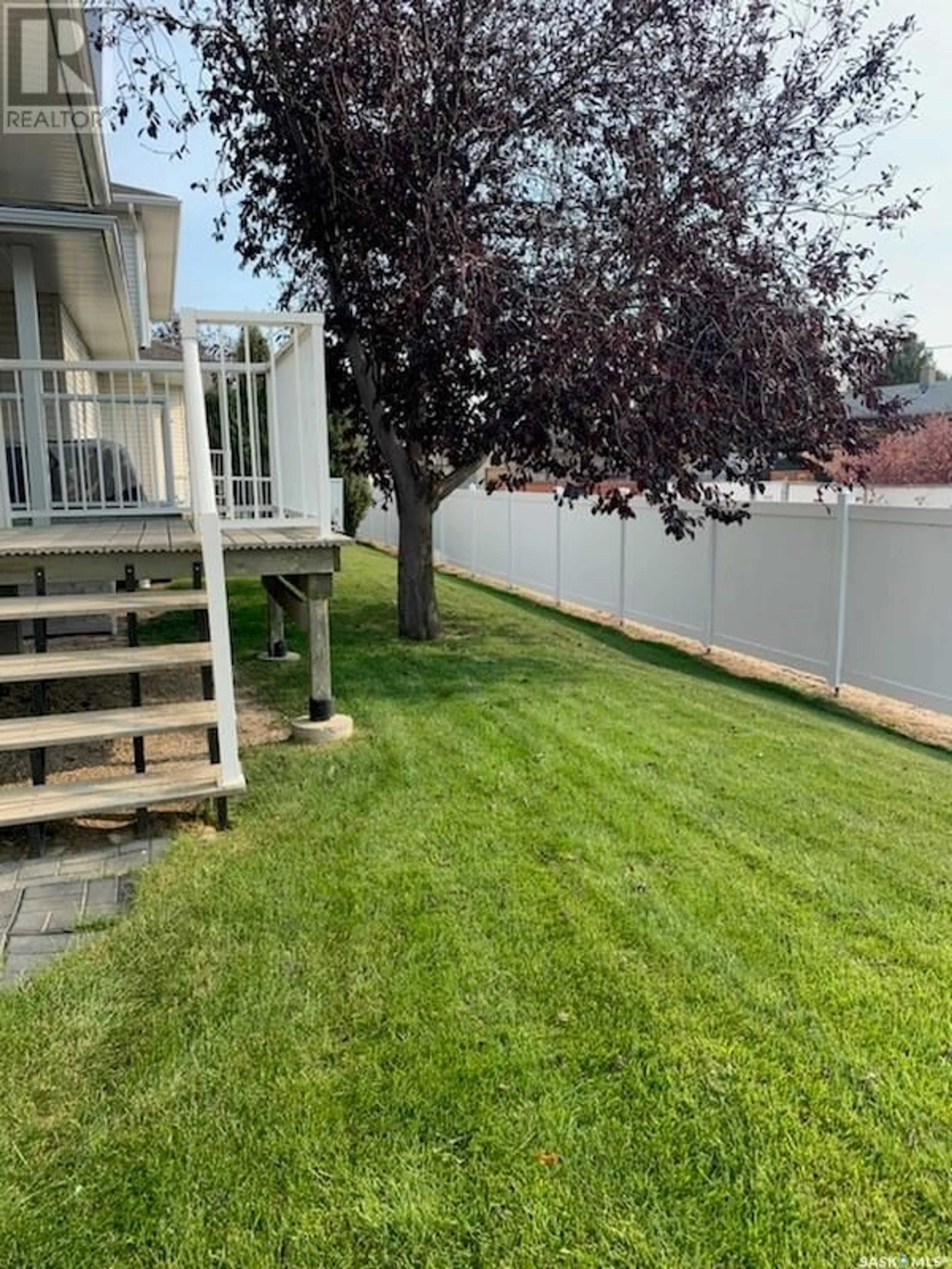 Frontside or backside of a home, the fenced backyard for 250 Mount Royal PLACE, Regina Saskatchewan S4T7X9