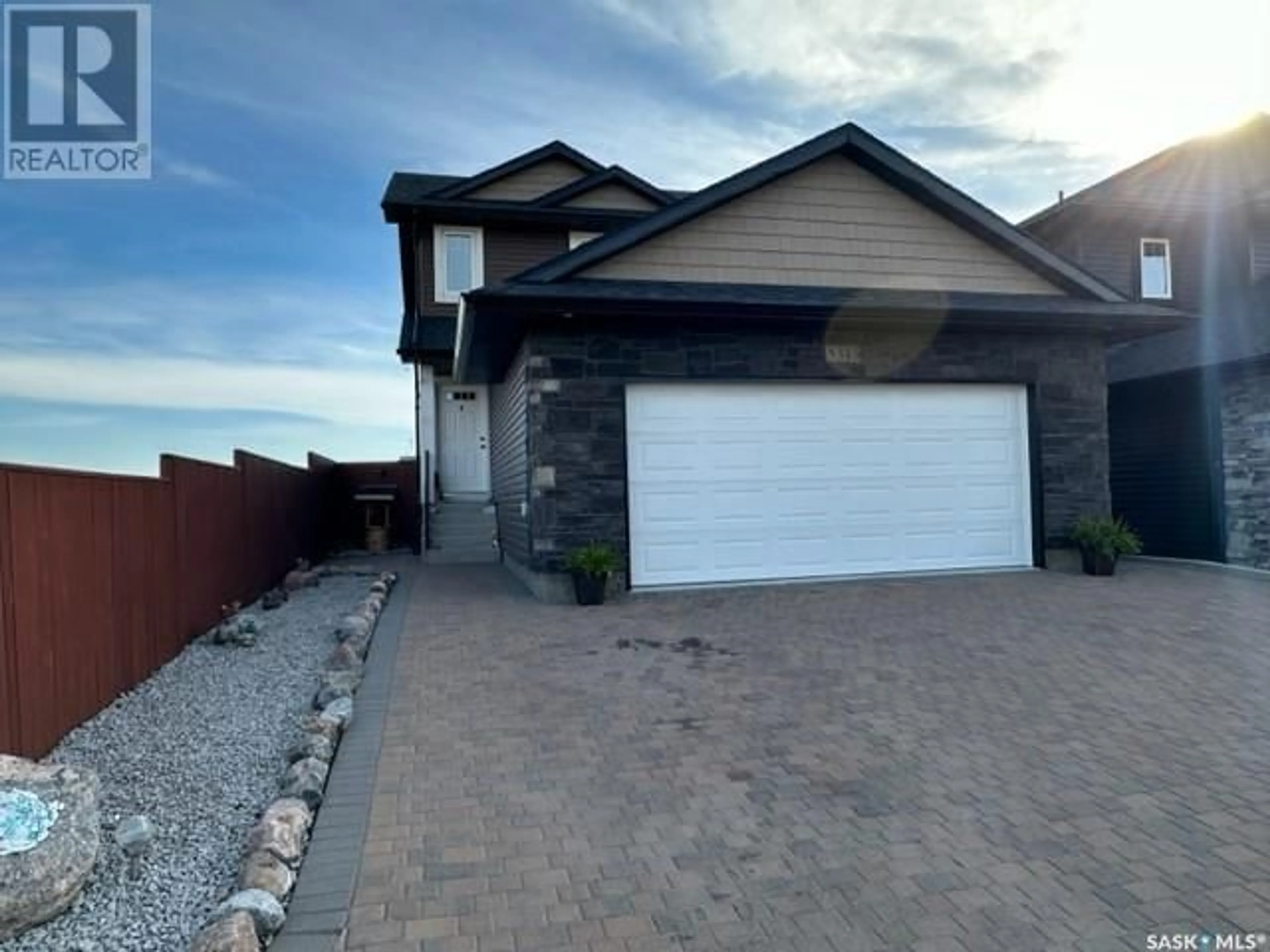 Frontside or backside of a home, the street view for 345 Bassett ROAD, Martensville Saskatchewan S0K0A2