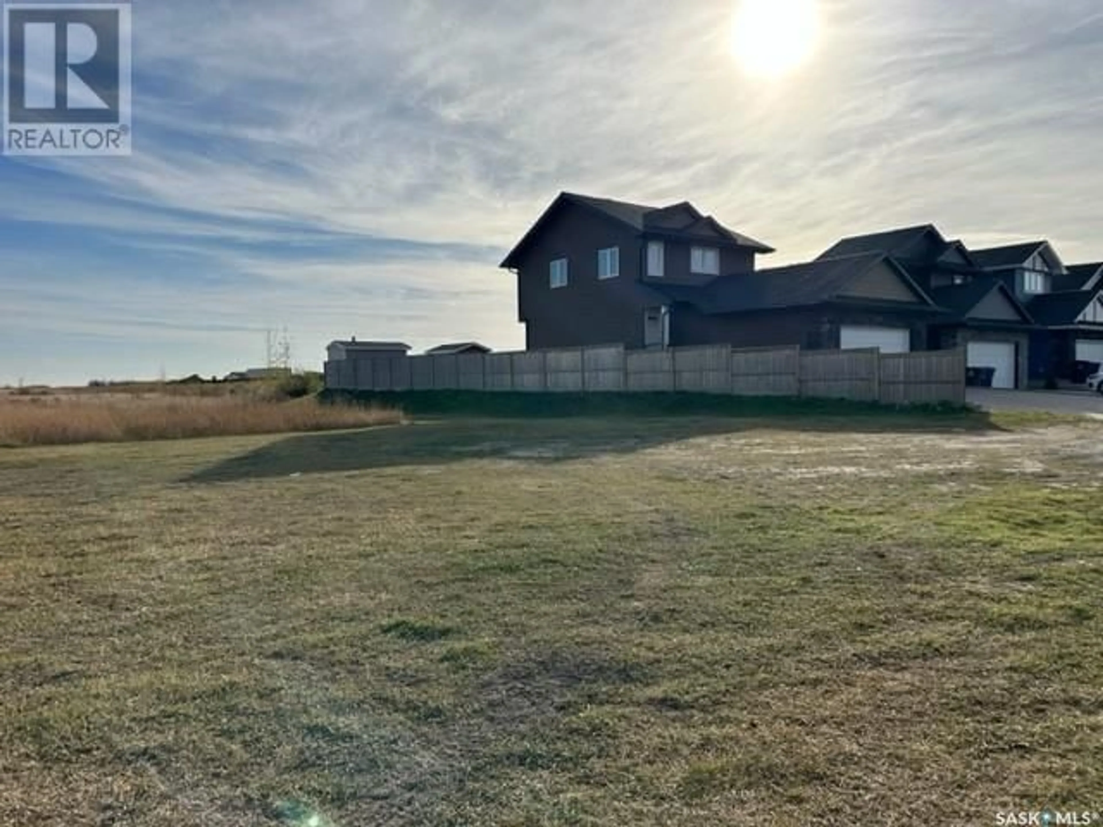 Frontside or backside of a home, the fenced backyard for 345 Bassett ROAD, Martensville Saskatchewan S0K0A2