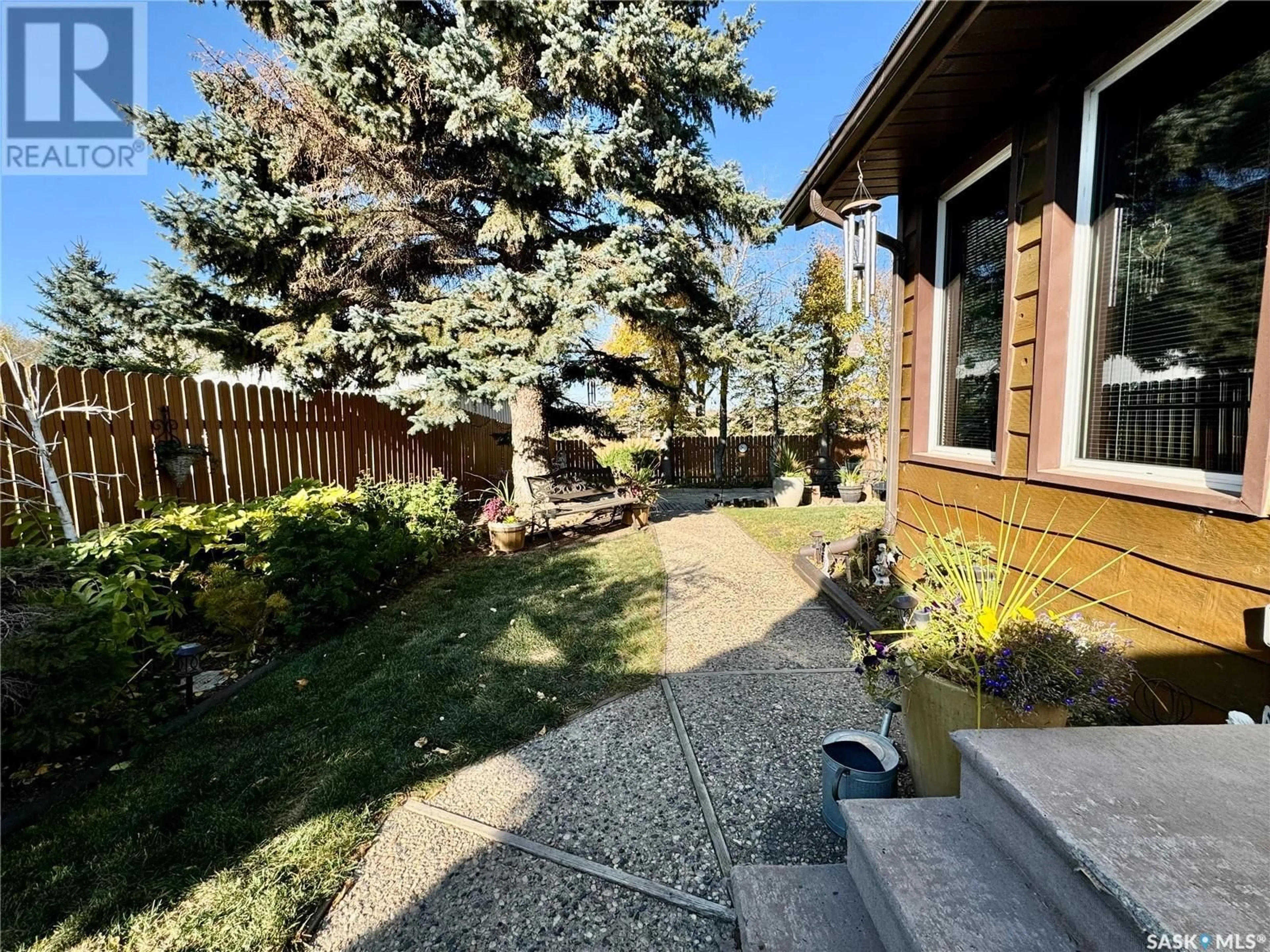 Frontside or backside of a home, the fenced backyard for 64 Clarewood CRESCENT, Yorkton Saskatchewan S3N2V2