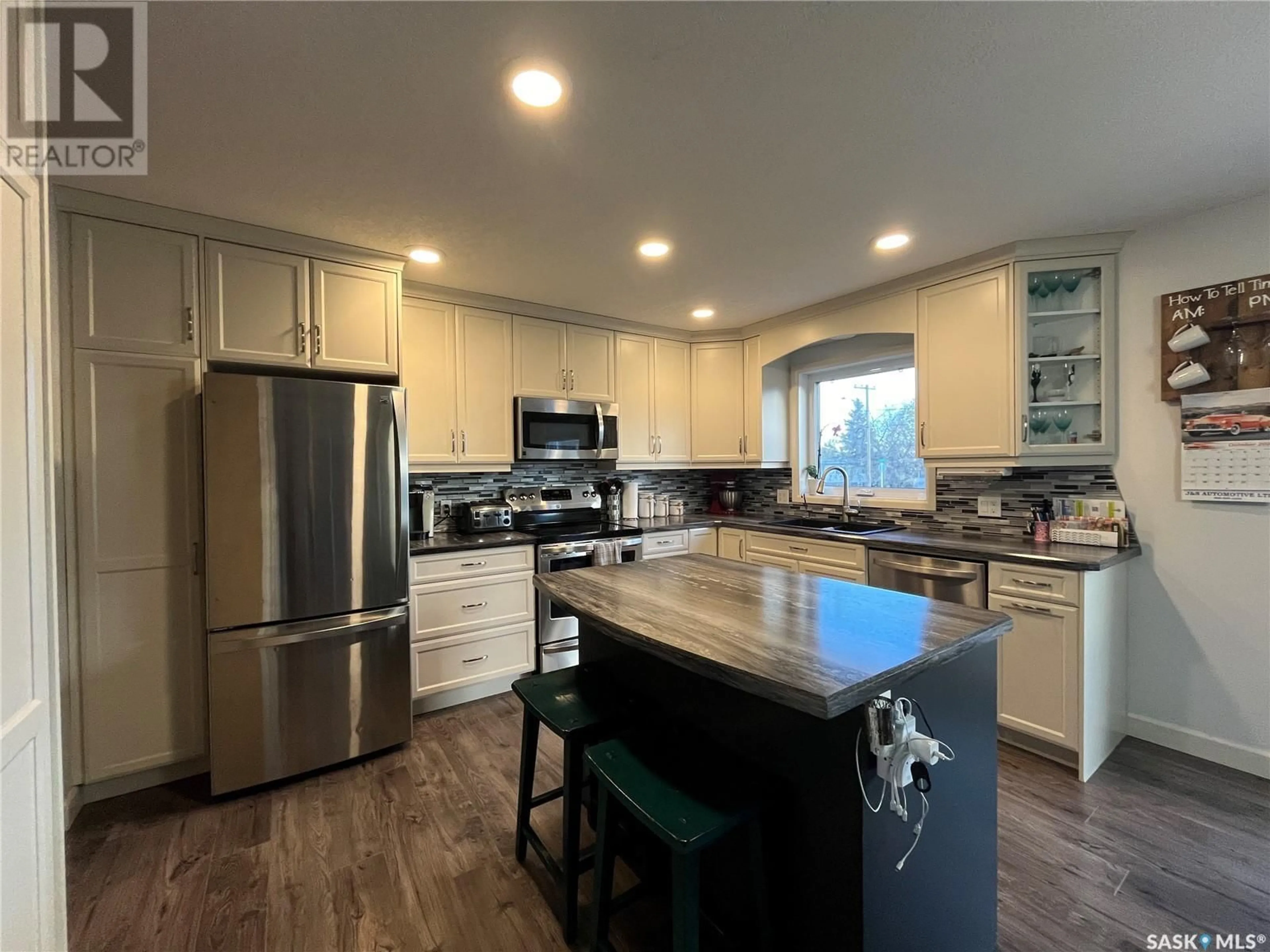 Open concept kitchen, wood/laminate floor for 515 FORBES STREET, Big River Saskatchewan S0J0E0