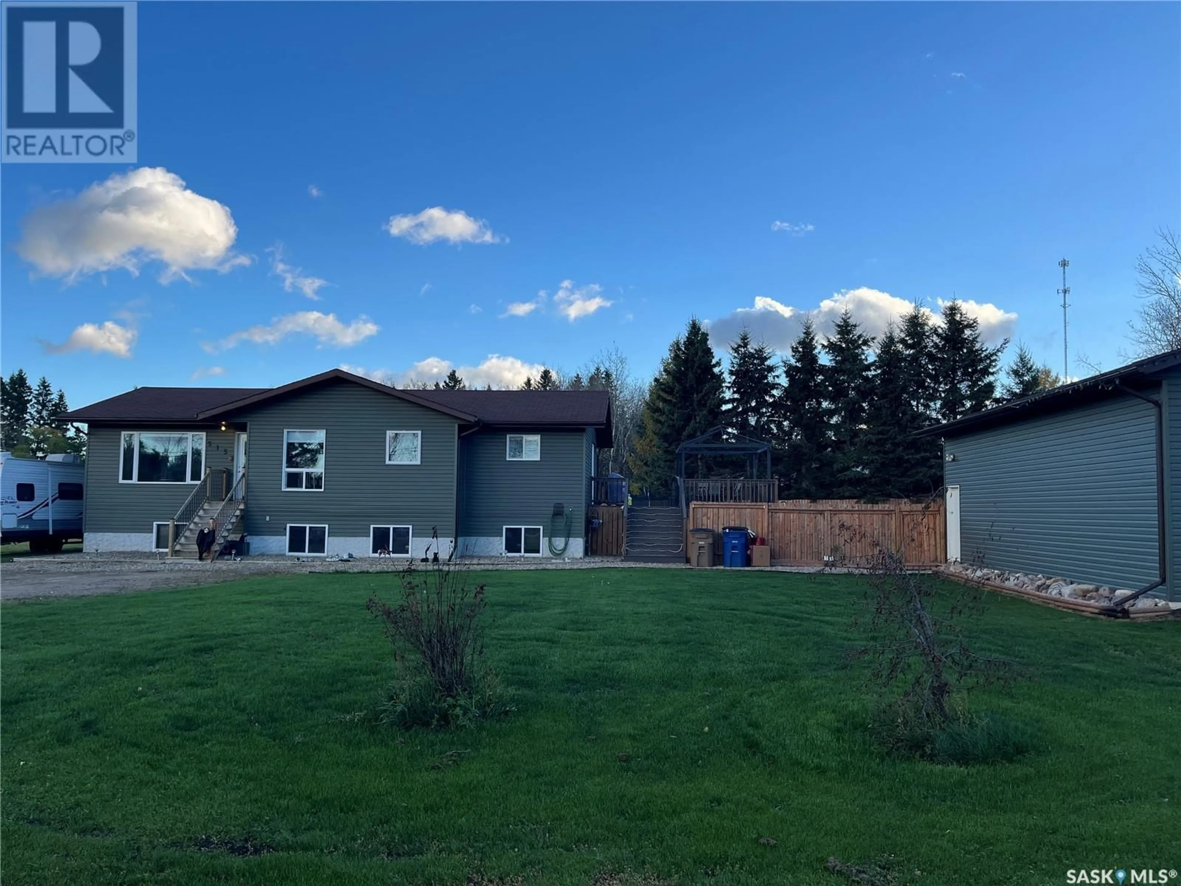 Frontside or backside of a home, the fenced backyard for 515 Forbes STREET, Big River Saskatchewan S0J0E0