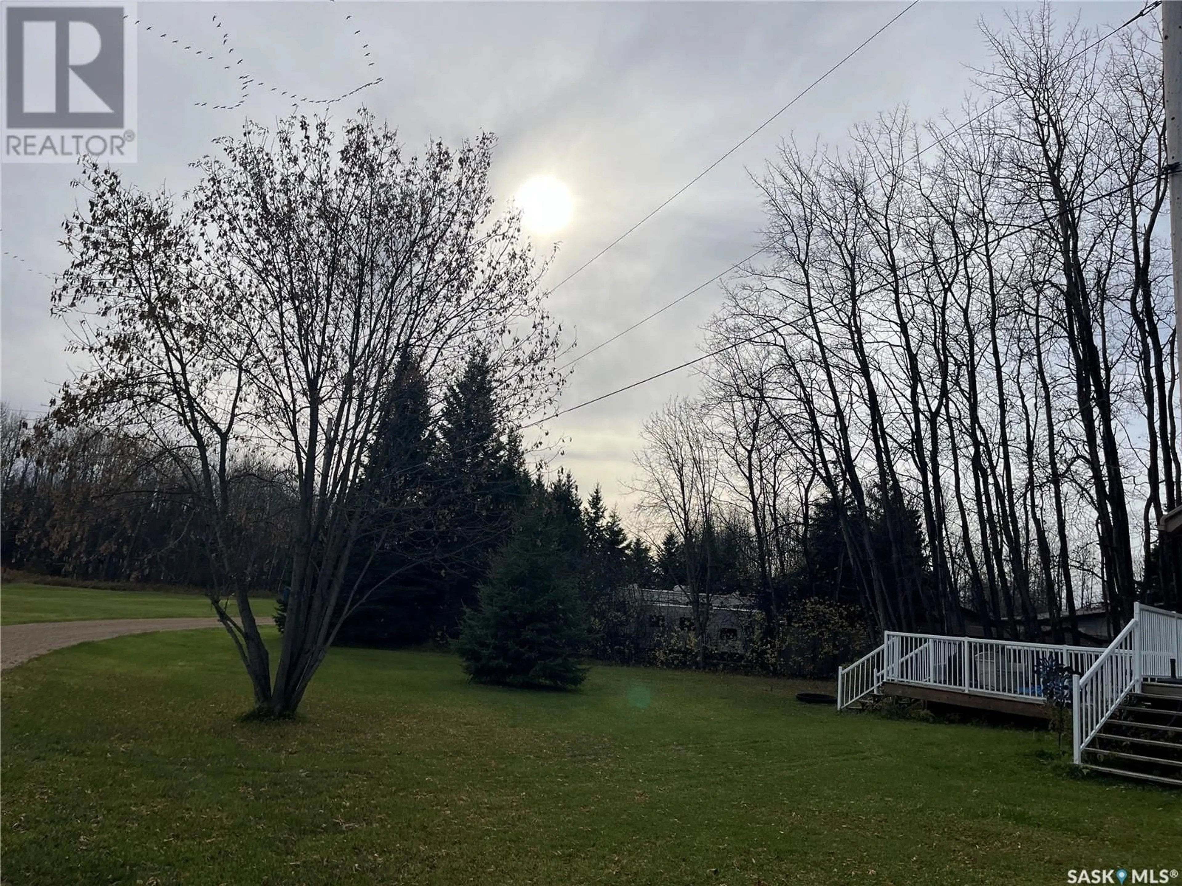 A pic from exterior of the house or condo, the fenced backyard for 6 Delaronde AVENUE, Delaronde Lake Saskatchewan S0J0E0